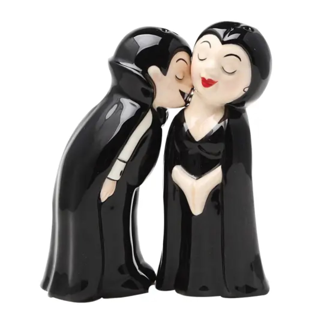 Ceramic figurine of a kissing couple in black formal attire