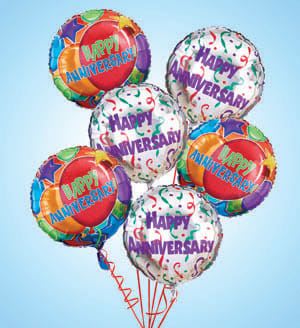 Cluster of colorful happy anniversary balloons on strings