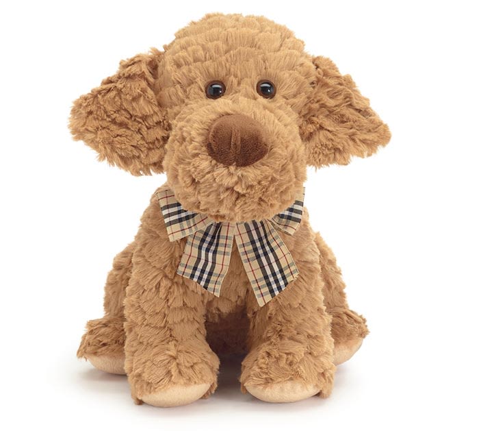 Plush brown dog with a plaid bow on a white background