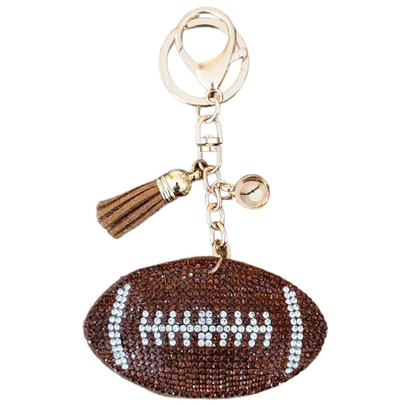 Football-shaped rhinestone keychain with a tassel charm