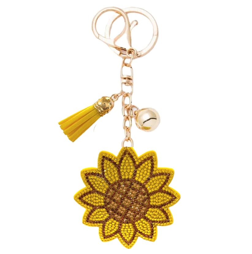 Sunflower-shaped keychain with a yellow tassel and bell