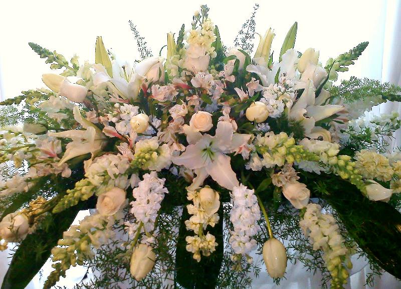 Large white floral spray with lilies and roses