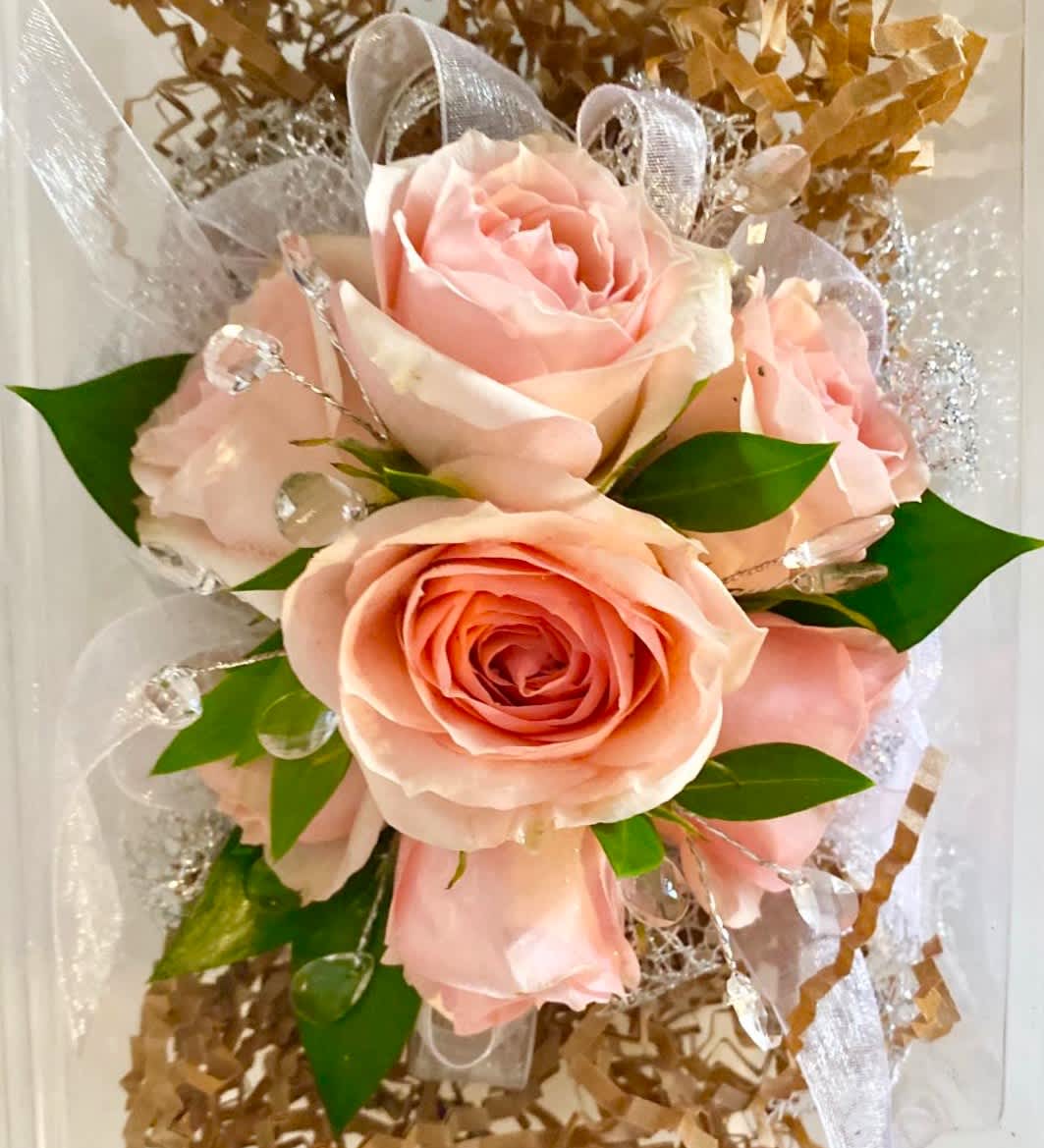 Bouquet of pale pink roses with clear decorative accents and ribbon