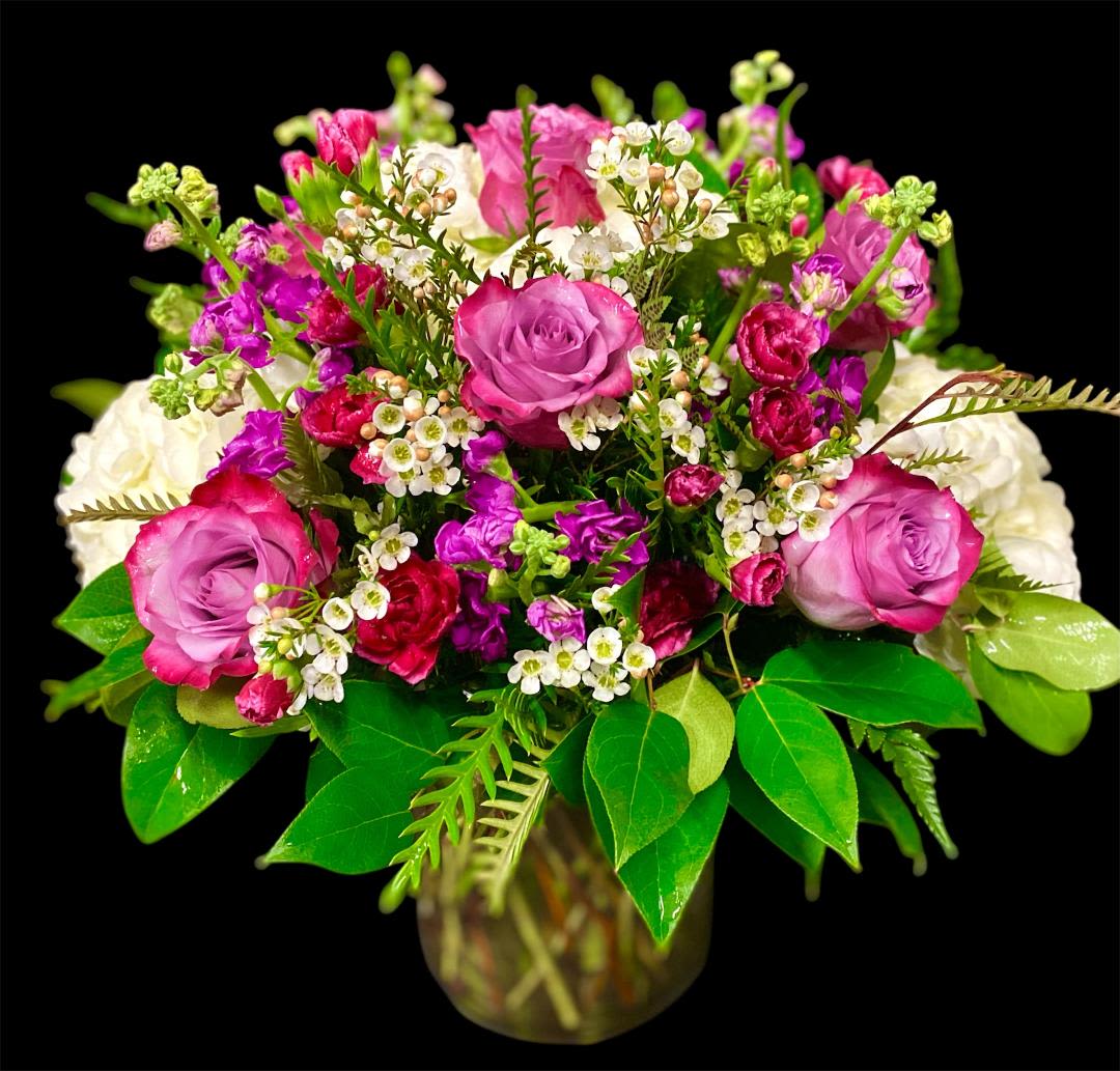 Bouquet of pink and white roses in a glass vase