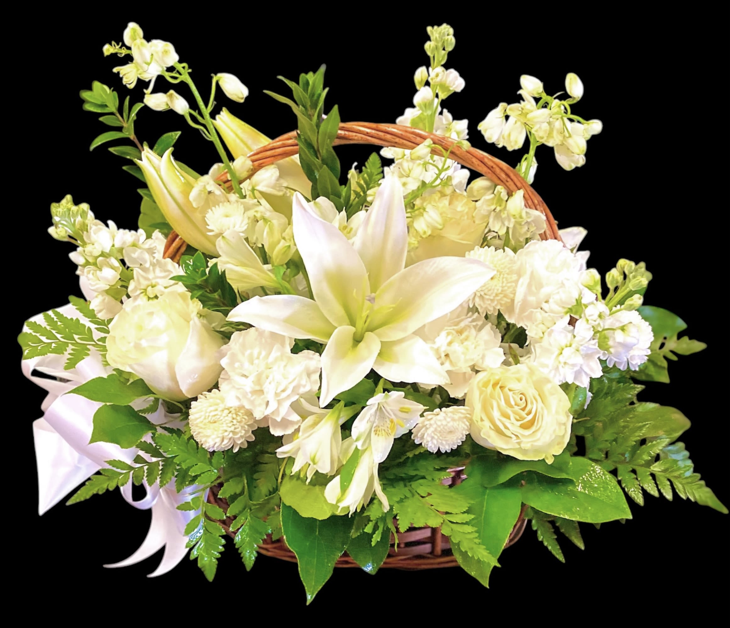 White floral basket arrangement with lilies and roses