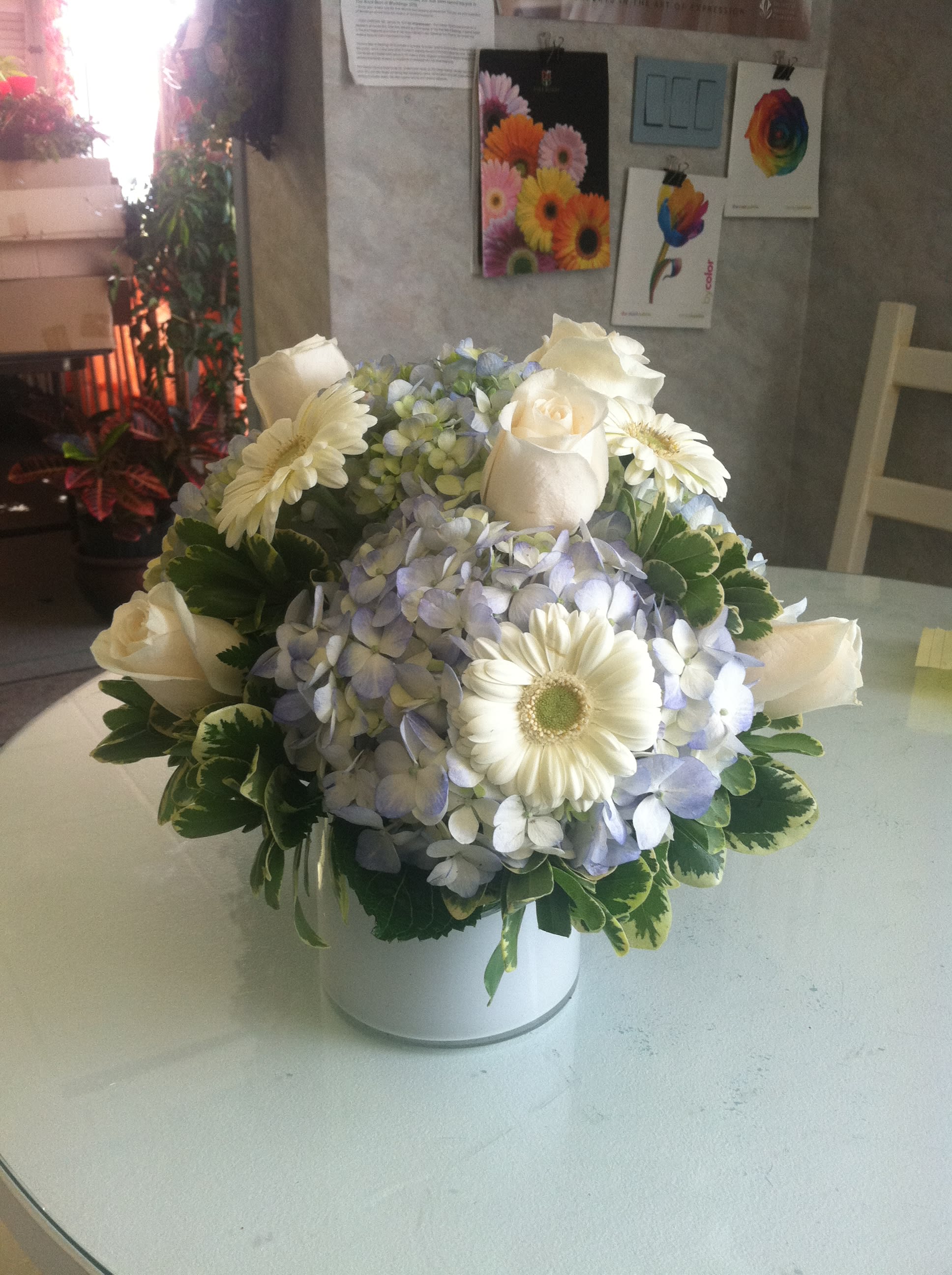 Elegant White and Blue Centerpiece - This arrangement was used for a baby shower, but the occasions that it's appropriate for are endless! An elegant mix of flowers make for a great much talked about centerpiece. Great for any party, event, or even an at home dinner party!