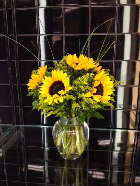 Smiling Sunflower Bouquet - This stunning sunflower bouquet is great for many occasions! Great for birthday, thank you, holidays, and even as centerpieces! No matter the occasion, everyone will feel warm and happy from the vibrant yellows and the elegance of this bouquet!