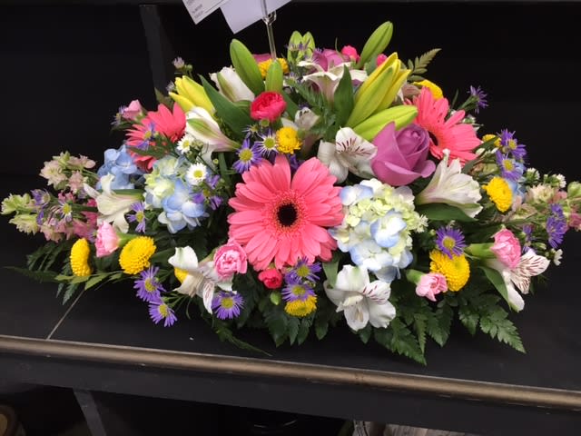 Spring Centerpiece - An incredible display of the freshest and most beautiful Spring flowers hand-crafted and designed centerpiece style. Great for every occasion, parties, and even a great centerpiece to display during Mother's Day Dinner.