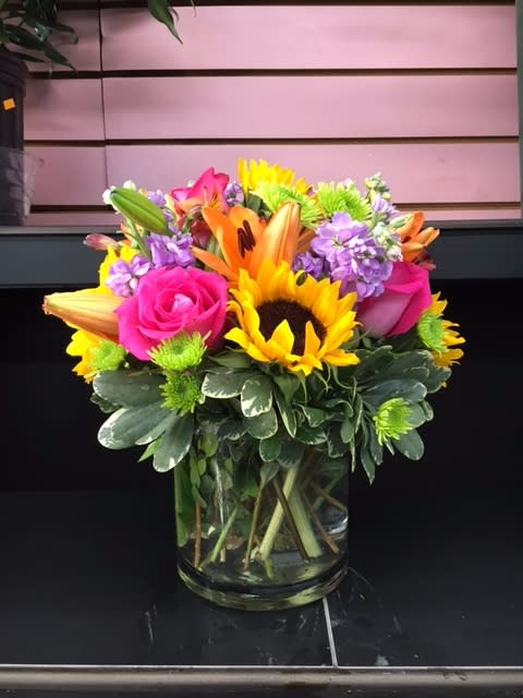 The Perfect Bouquet - The most stunning bouquet is hand-crafted and designed by our brilliant designers! Made with love and care, this vibrant bouquet is a great gift to send to any loved one for any occasion! Great as a centerpiece at dinner, a bouquet for the coffee table, or buy a few for centerpieces for parties! Includes a little bit of everything including everyone's favorites...some roses, lilies, and sunflowers!