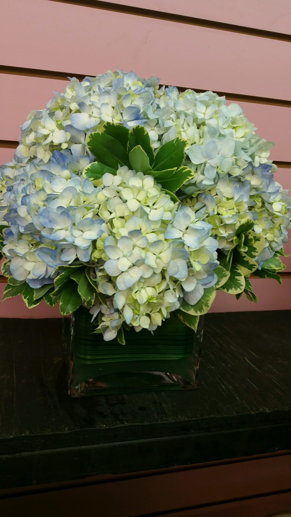 Hydrangea Bouquet - This beautiful in blue bouquet is great for parties, dinner tables, and even can be sent as a gift to a loved one during any special occasion! Handcrafted and designed in a clear glass cube vase for that added elegant touch!