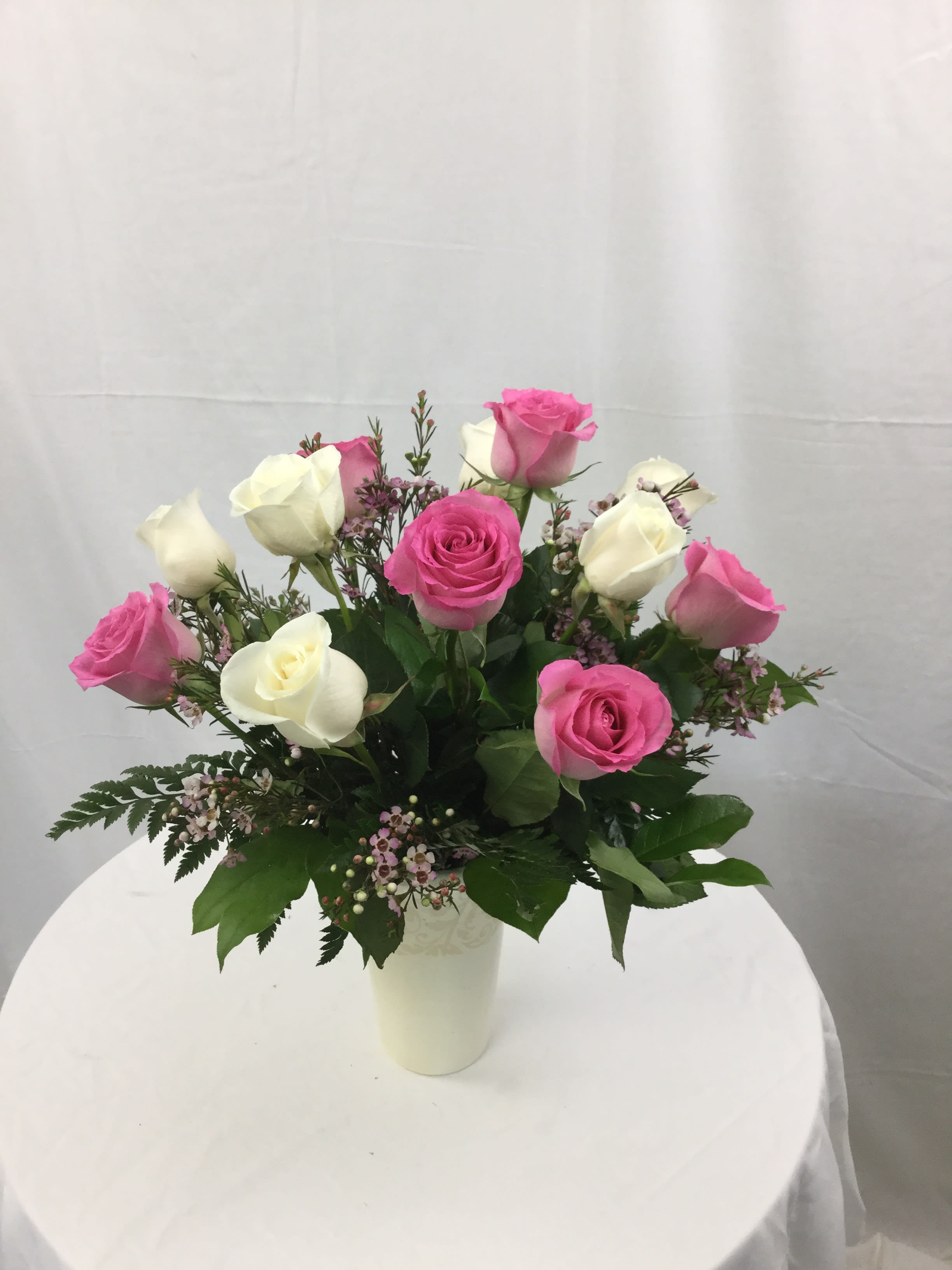 Pleasantly Pink Rose Bouquet - Welcome Spring with this lovely rose bouquet. Pink and White Roses designed in an elegant vase make for a soft and beautiful statement piece. Makes a wonderful gift during the Spring and Summer Seasons.