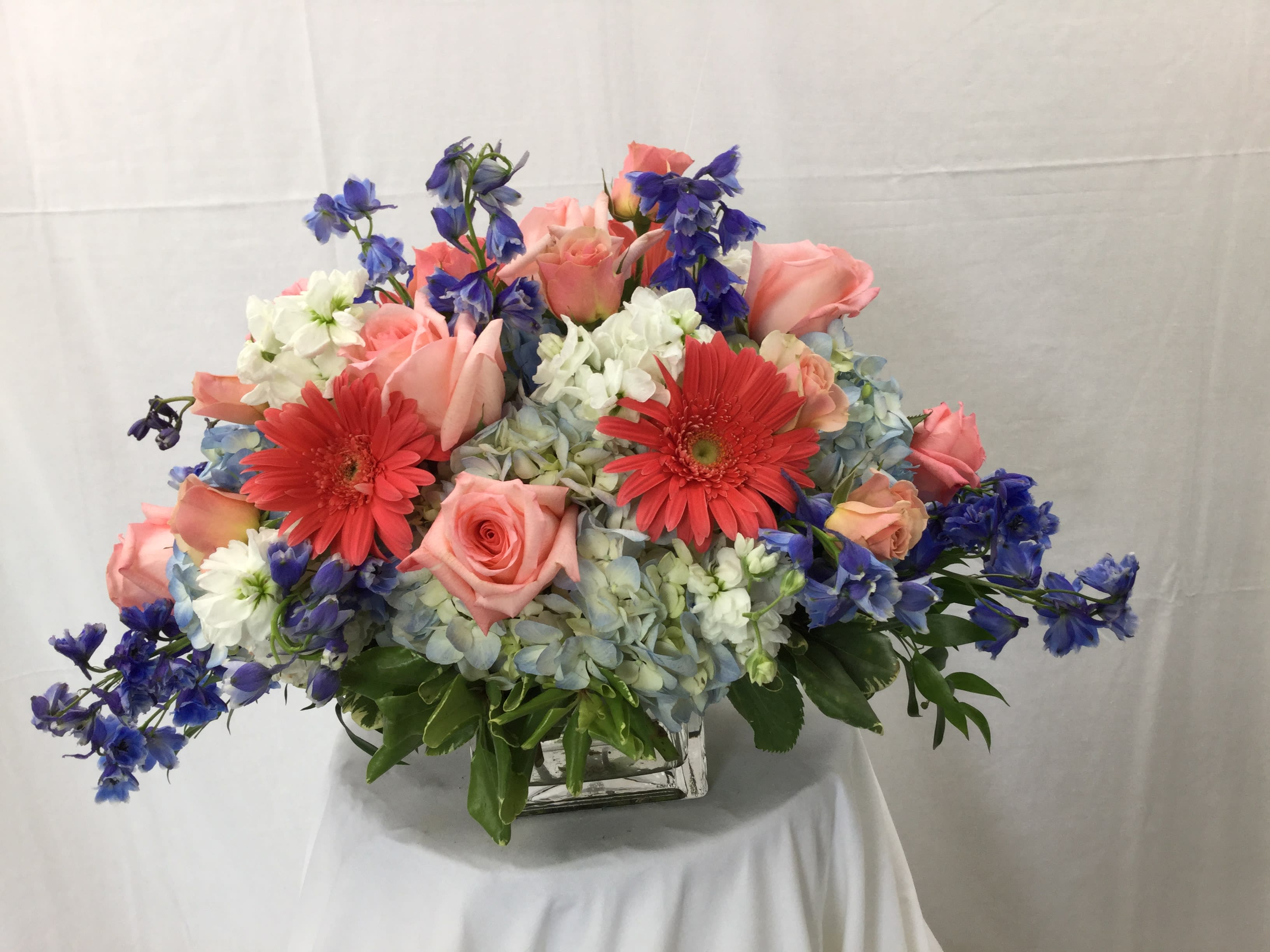 Grand Cube Bouquet - This stunning and one of a kind bouquet makes for a wonderful gift. It also makes for a great dinner table centerpiece, coffee table centerpiece and even looks great in an office.