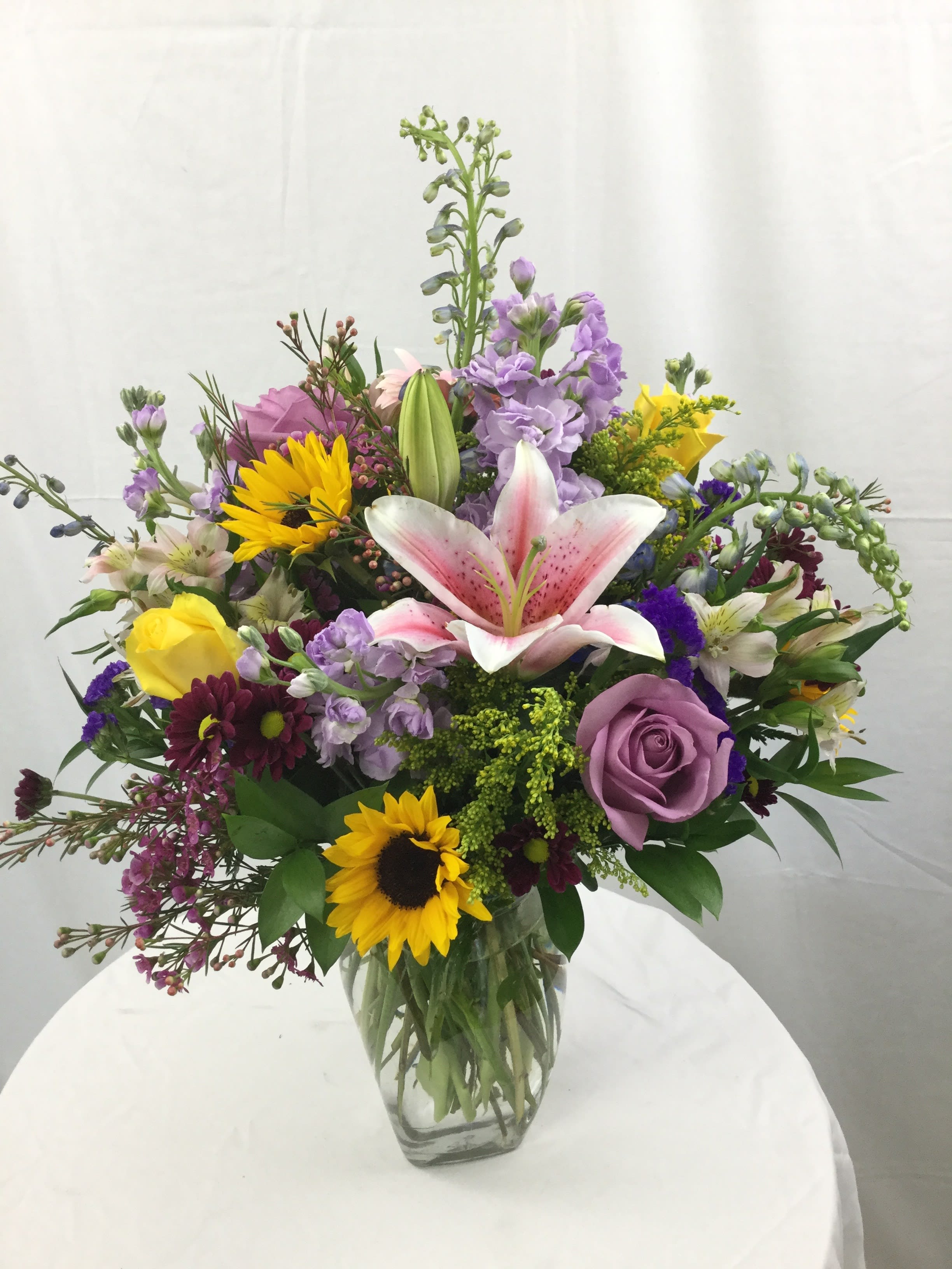 Spring Madness Bouquet - This stunning bouquet is full of fresh Spring blooms in many shades that compliment each other wonderfully. This large bouquet makes for a great gift!