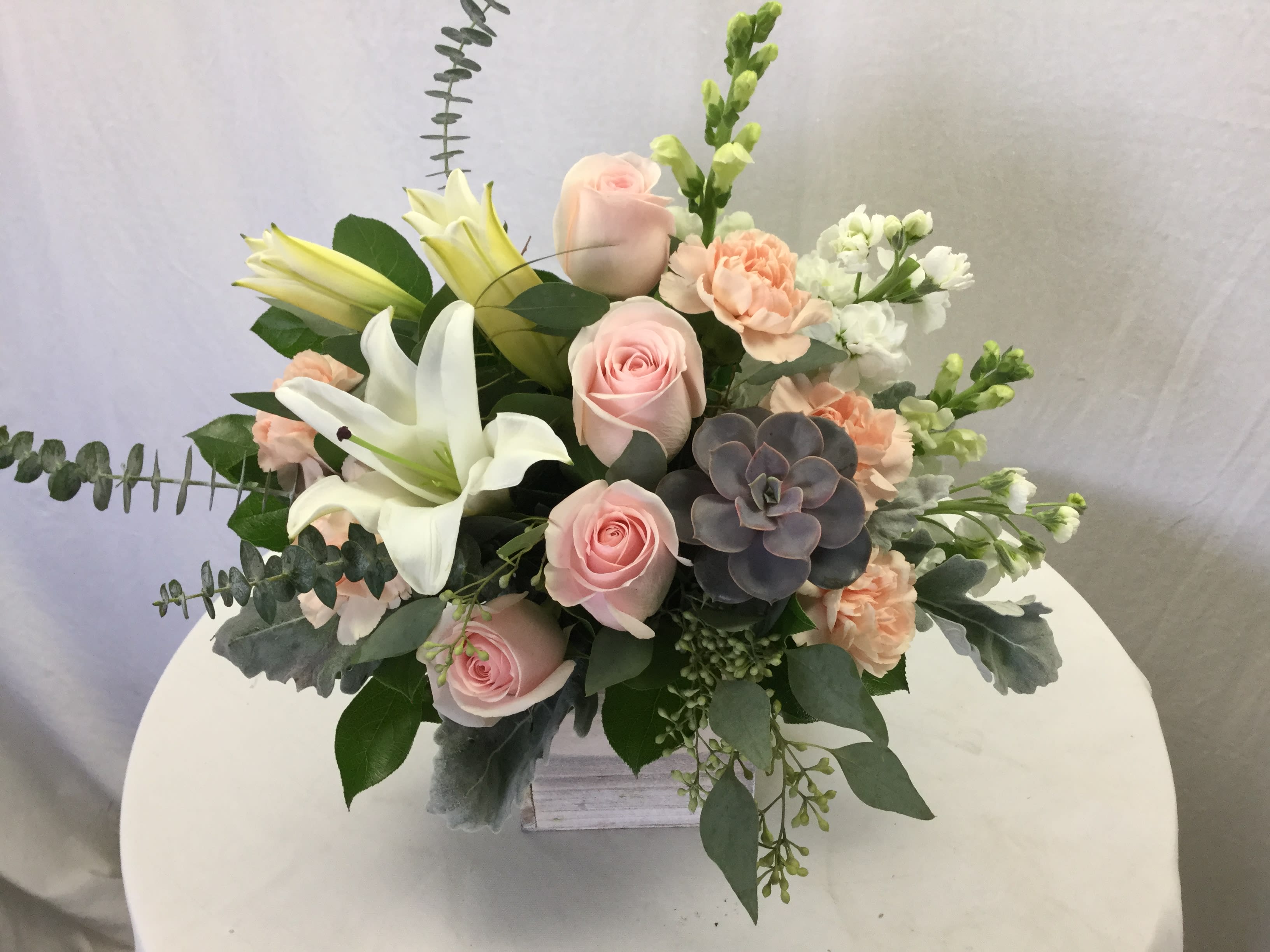 Embrace the Beauty Bouquet - This stunning arrangement makes for a wonderful gift for every special occasion. It can be used as a centerpiece, coffee table decor and can even be used for parties. Send to a loved one or treat yourself. Note: Fresh blooms arrive to us in bud form. Some of the lilies will be sent out in bud form because we consistently get in the freshest blooms daily.
