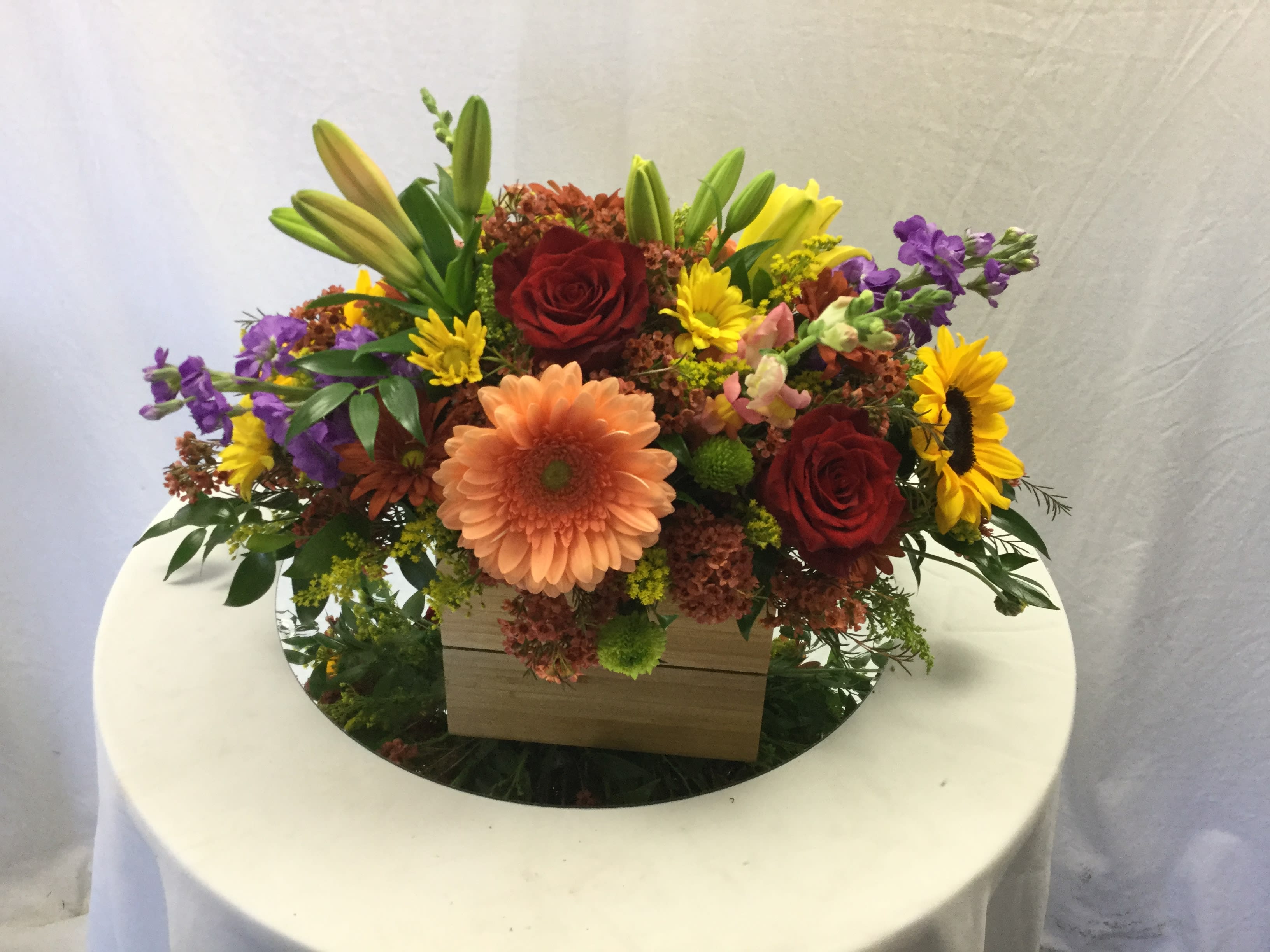 Thanksgiving Centerpiece - Includes a beautiful mix of fresh Autumn blooms, fresh greenery and a keepsake brown basket.