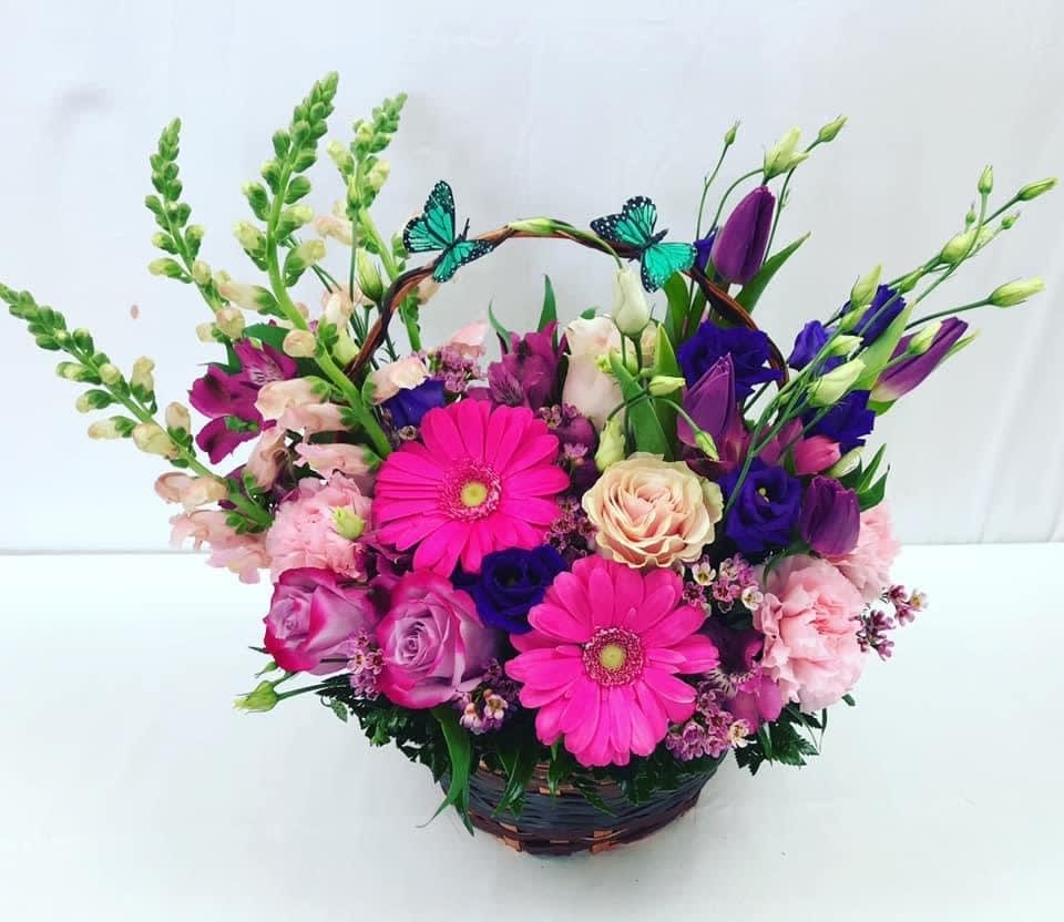 Beautiful Butterfly Basket - Send this stunning basket arrangement to a loved one today! Full of fresh beautiful Spring blooms, fresh greens and butterflies. Handcrafted and designed with love and warmth in mind. Basket may vary due to Covid-19 shipment delays.