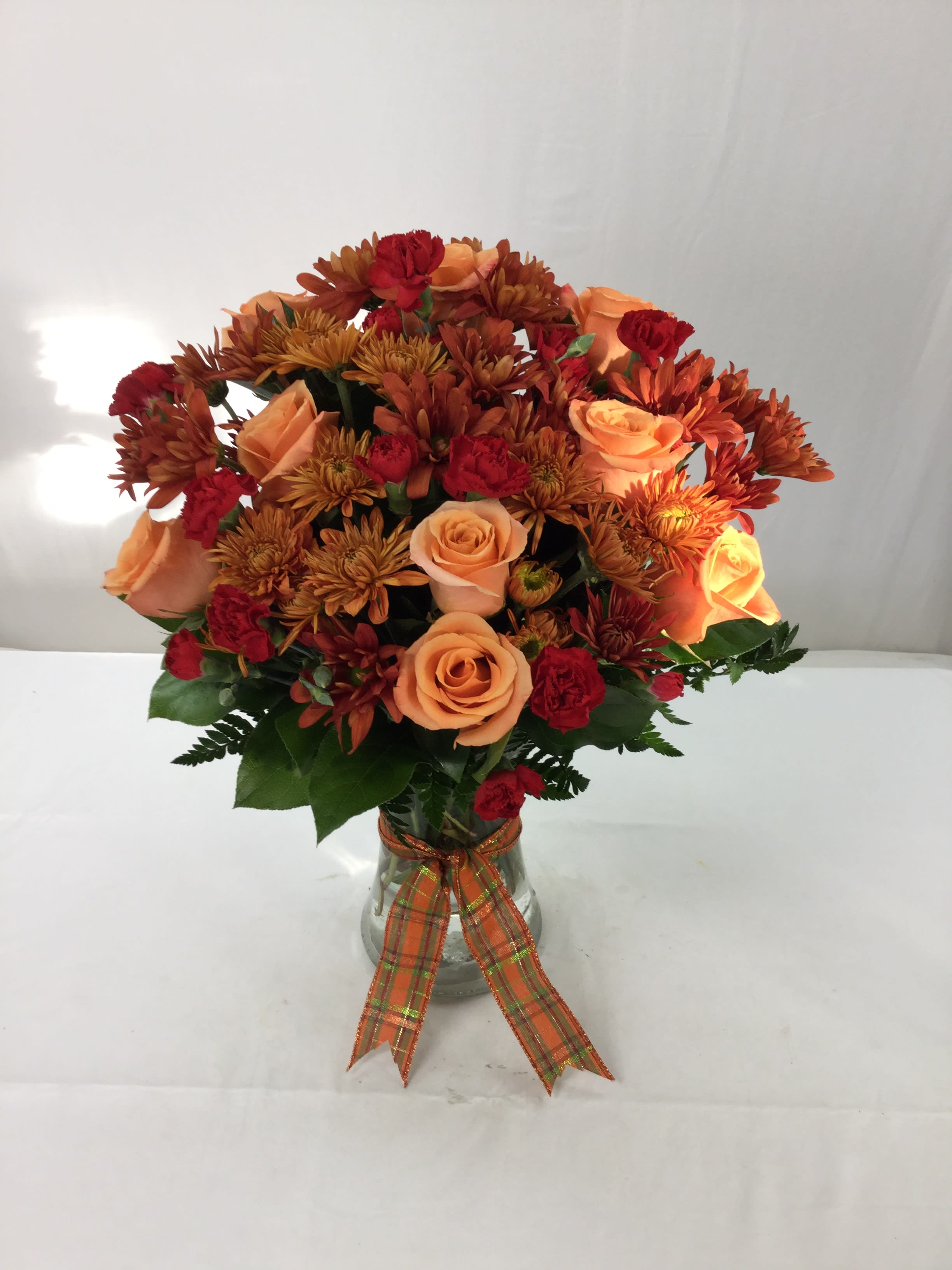 Thankful Bouquet - This stunning bouquet makes for a wonderful gift for the Autumn and Holiday season. Send to a loved one or put it on your dinner table for Thanksgiving dinner. Full of fresh blooms and greens, this handcrafted bouquet is a beautiful sight to see.