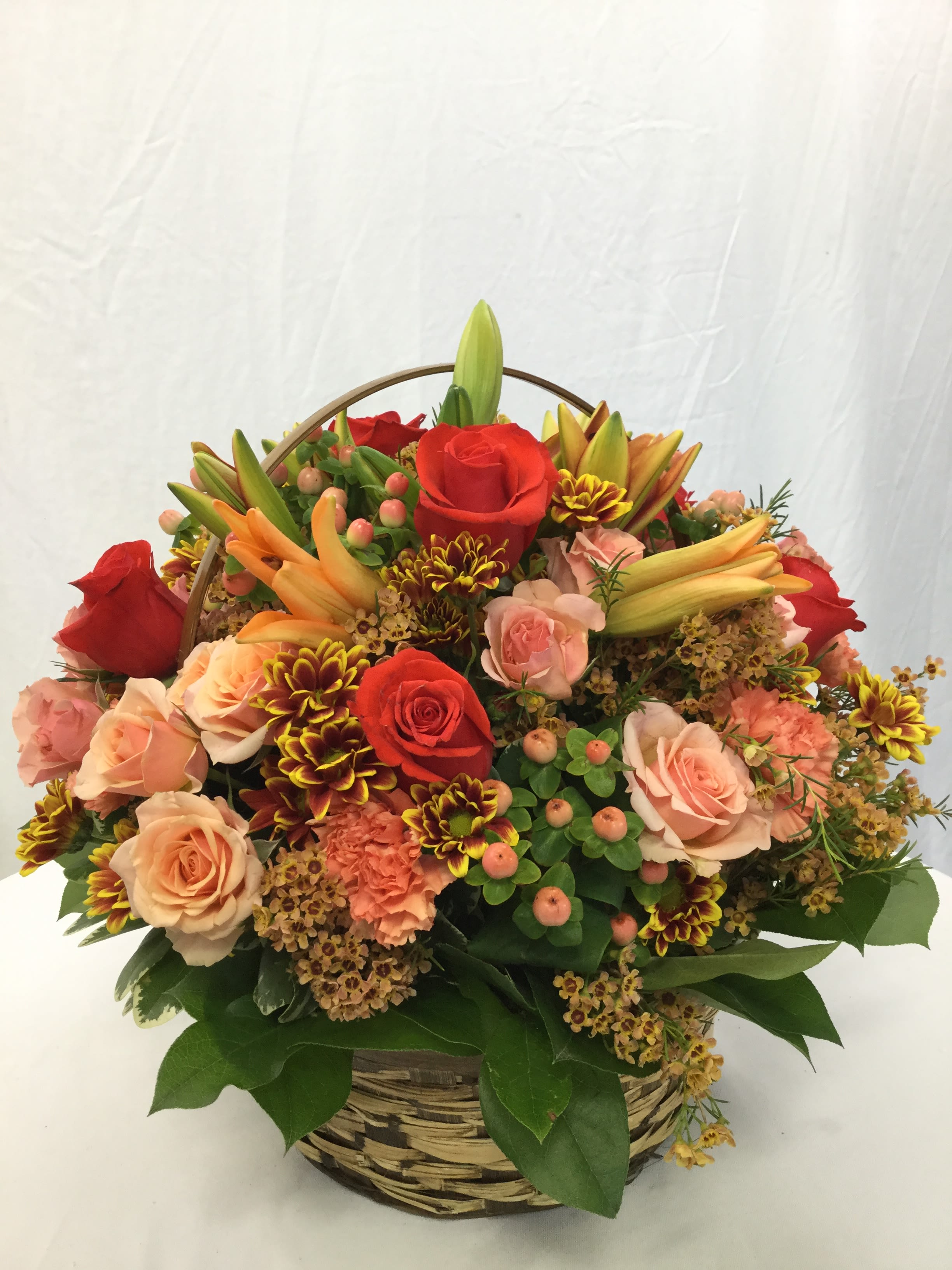 Autumn Basket Arragement - This beautiful mix of fresh autumn blooms and greenery make for the most perfect gift this Autumn Season! Includes basket.
