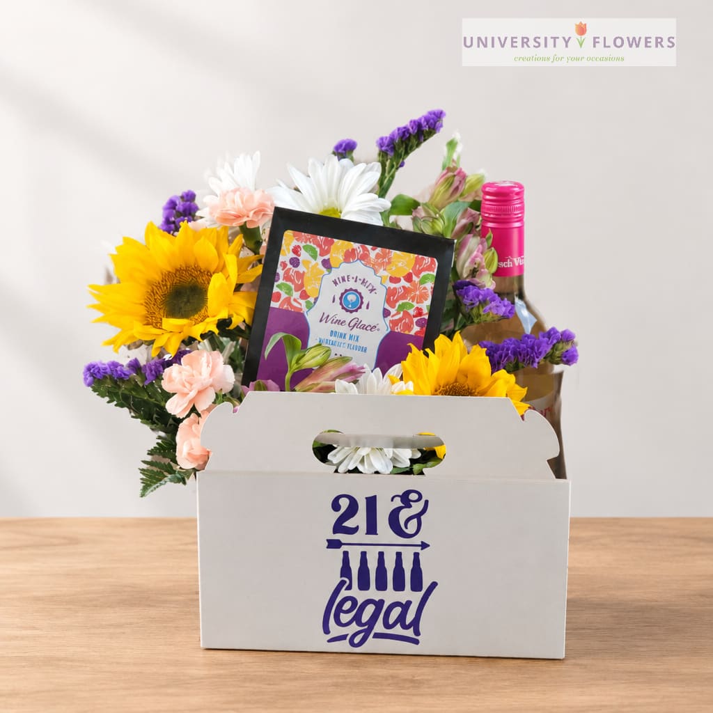 Mixed flower gift box with a wine bottle and candy package