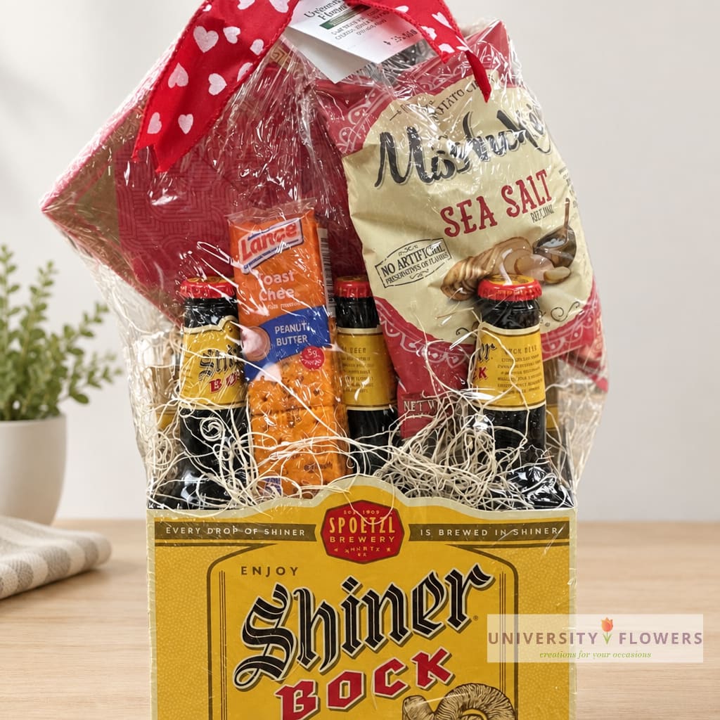 Gift basket with beer bottles and snacks wrapped in clear cellophane
