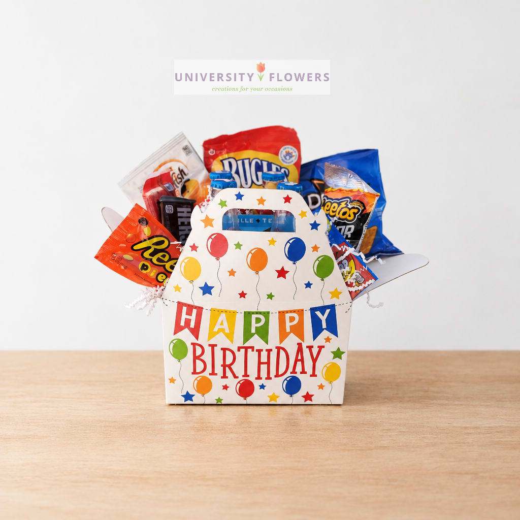 Birthday gift bag filled with assorted snacks and candy