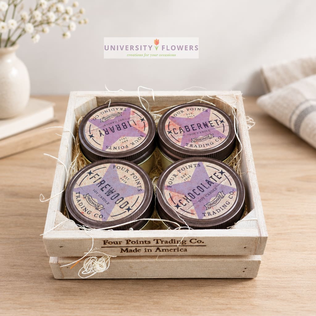 Wooden crate holding four scented candles on a table
