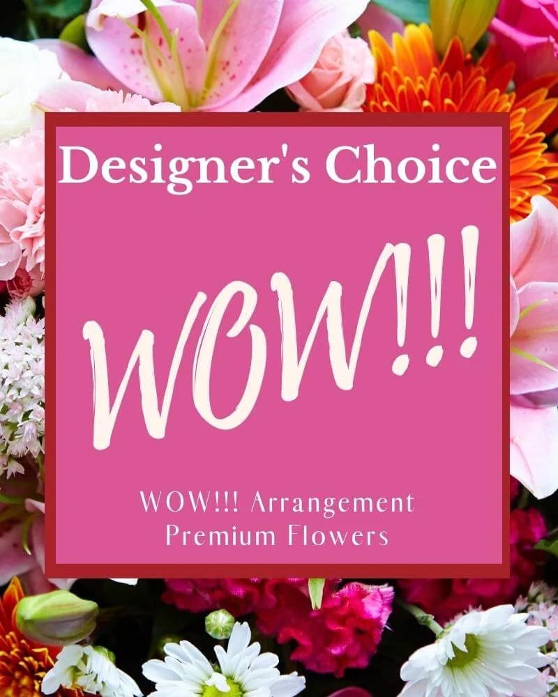 Designer’s choice flower arrangement with pink, white, and orange blooms