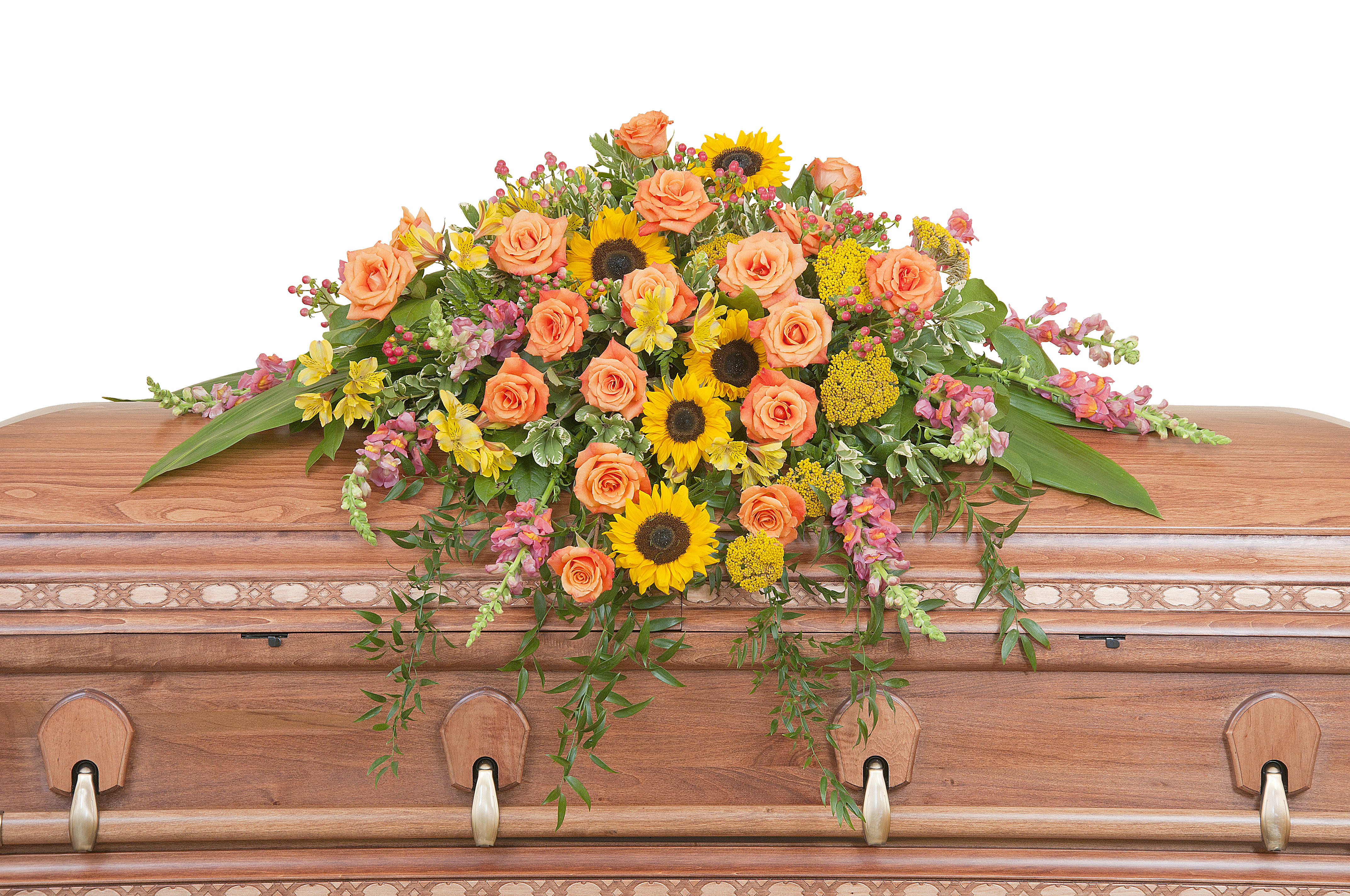 Heaven's Sunset Casket Spray - The colors of sunset are evident in this beautiful spray of Sunflowers and Roses with accents of other premium flowers and foliage. Approximately 43" wide 36" deep