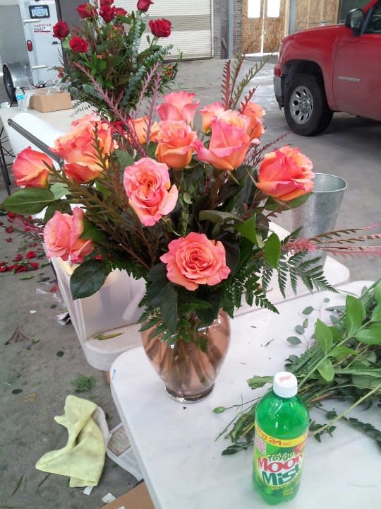 Dozen Roses any color - 12 roses vased with greens and filler.  