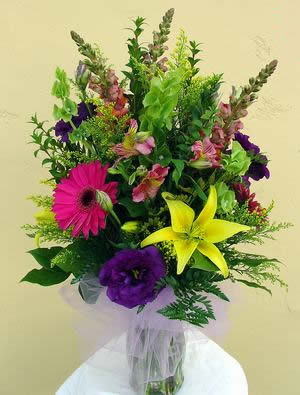 Non-Fragrant Lillies - Bright mix with non-fragrant lillies in standard vase.   (14"w x 22"h)