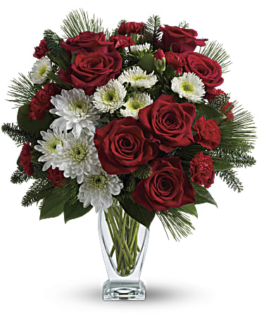 Teleflora's Winter Kisses Bouquet - No mistletoe required! Simply send this romantic bouquet of snow whites and rich reds arranged in our sculpted glass vase, and you're guaranteed a spot on her "nice" list.