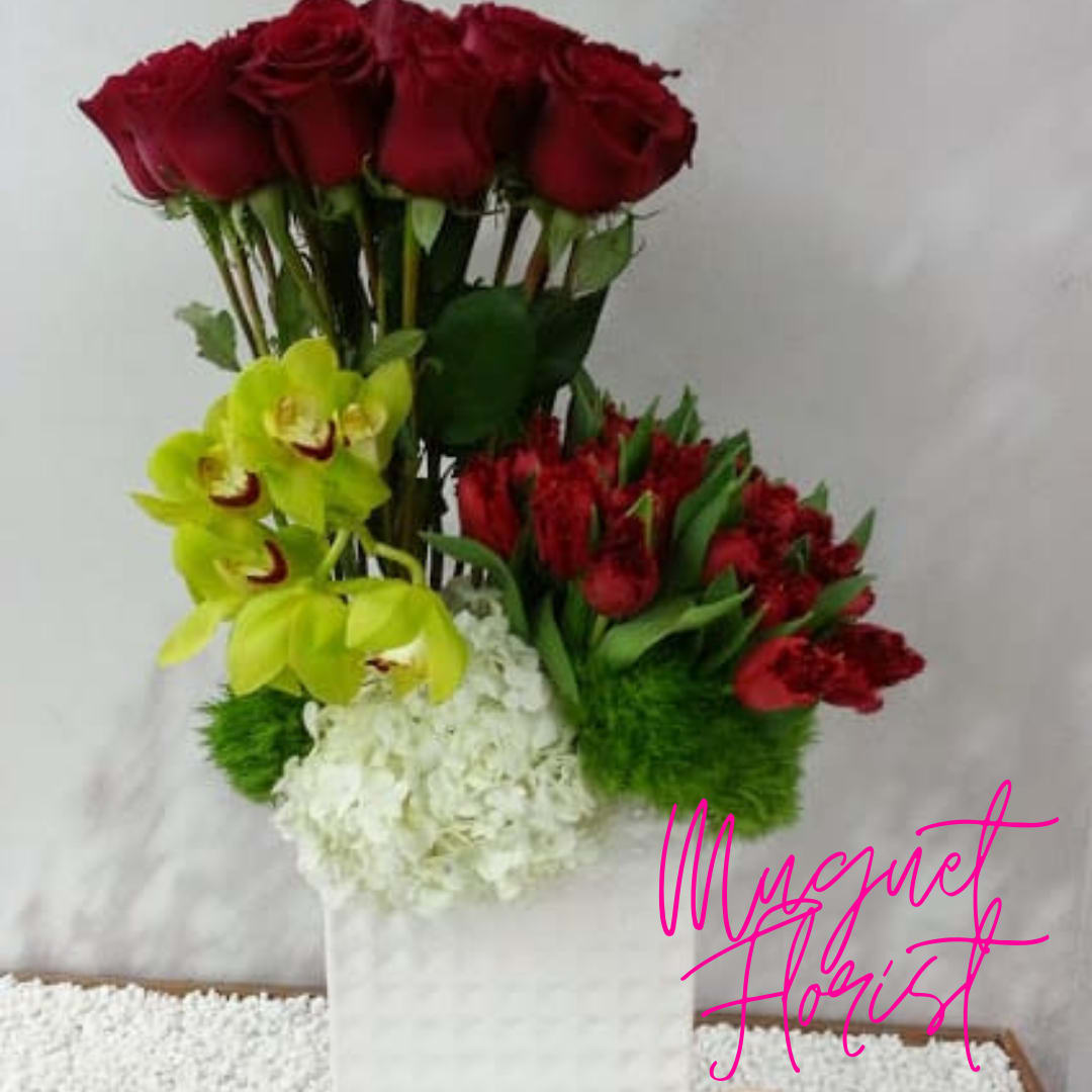 Bouquet of red roses, yellow orchids, and white hydrangea in a white wrap