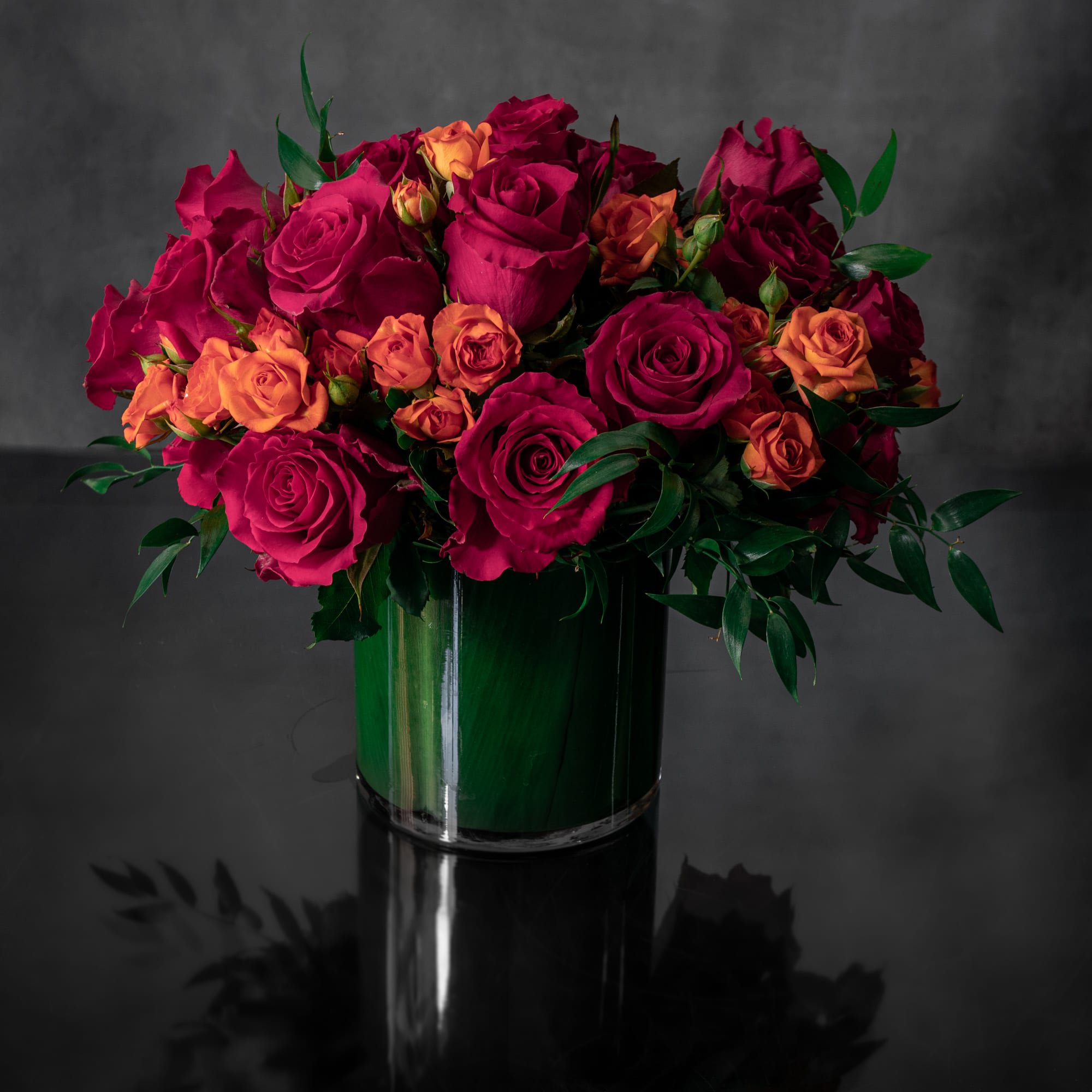 Summer Roses  - A lavish array of Spring Peonies, Winter Roses, Daffodils, Tulips and Hydrangeas. Send this glamorous display of blooms to dazzle your loved one.  Standard 6x6 inch base (Deluxe pictured)