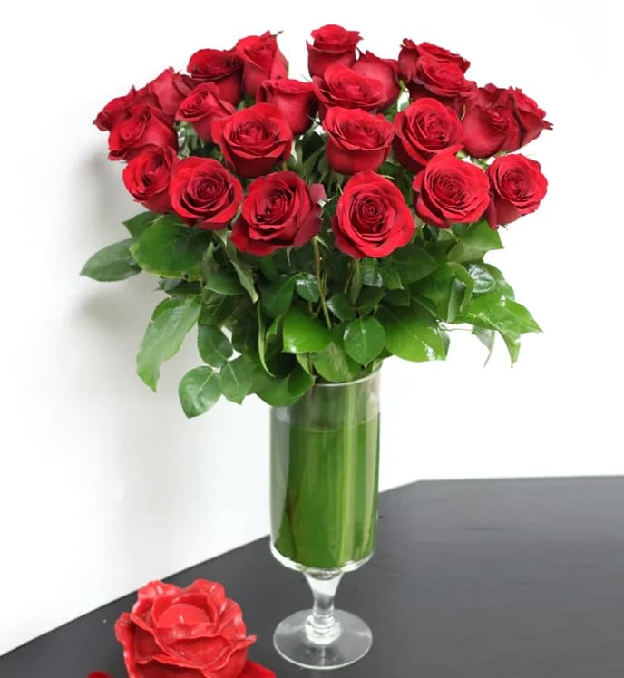 Mi Amore - Simple elegance.... this lovely glass footed vase holds  2 Dozen Imported Red Ecuadorian Roses. A classic look that always impresses.   