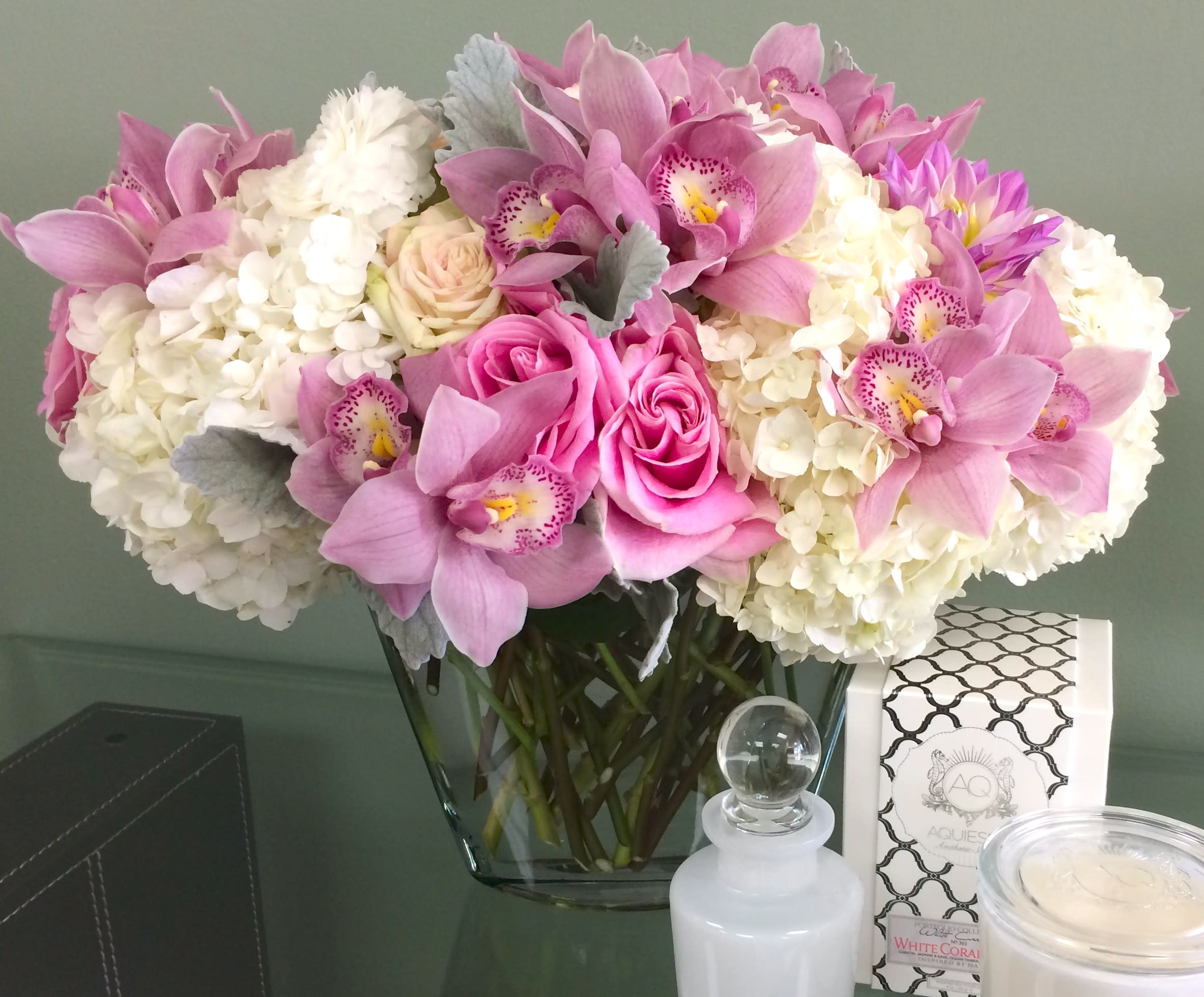 Girly Girl - My Sherman Oaks Florist presents this arrangement features dimensions of a base of 5", a head of 15", and a height of 12". The design also features brilliant pink Orchids and Roses in a glass vase. Girly Girl is one of our best sellers because it makes a classy gift idea for any time of year; and its chic look makes it a must have for any home decor.   As shown Deluxe