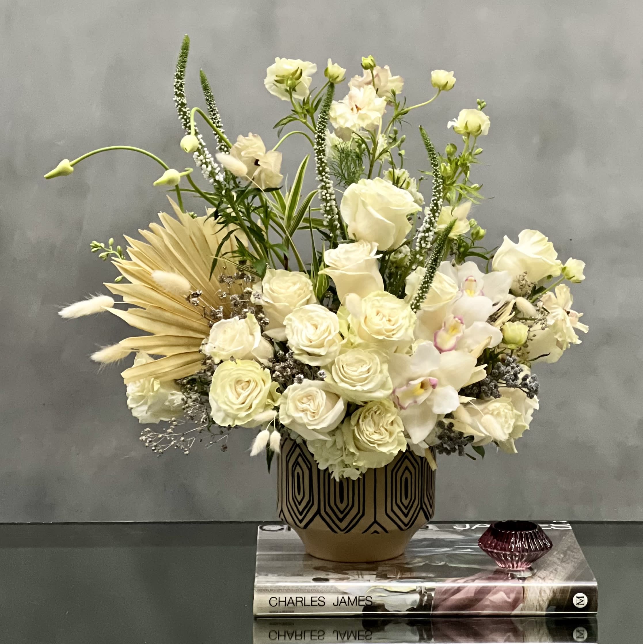 Designer's Choice - Isle of White - This arrangement is made with a designer's choice array of seasonal white flowers. Floral could include Roses, Hydrangeas, Orchids and seasonal white florals . These beautiful white flowers are an excellent choice for weddings, funerals and other major life events. Our team at Beverly Hills Florist offers same day delivery! 