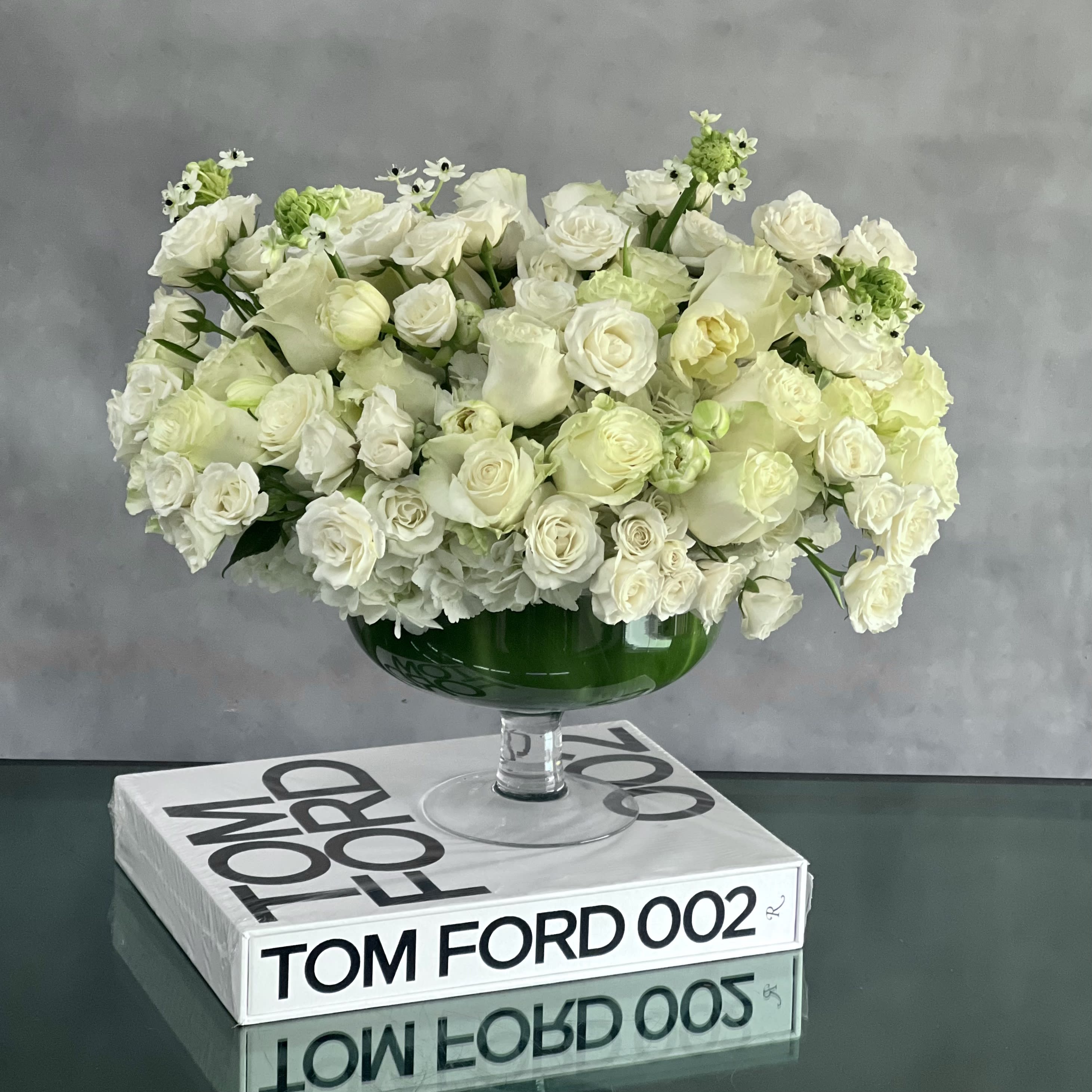 Capture the Heart - Want to make today a heavenly one for someone you know? Send this beautiful design with a variety of White Roses in a pedestal vase. Purity and elegance at its finest!  14" Round.   