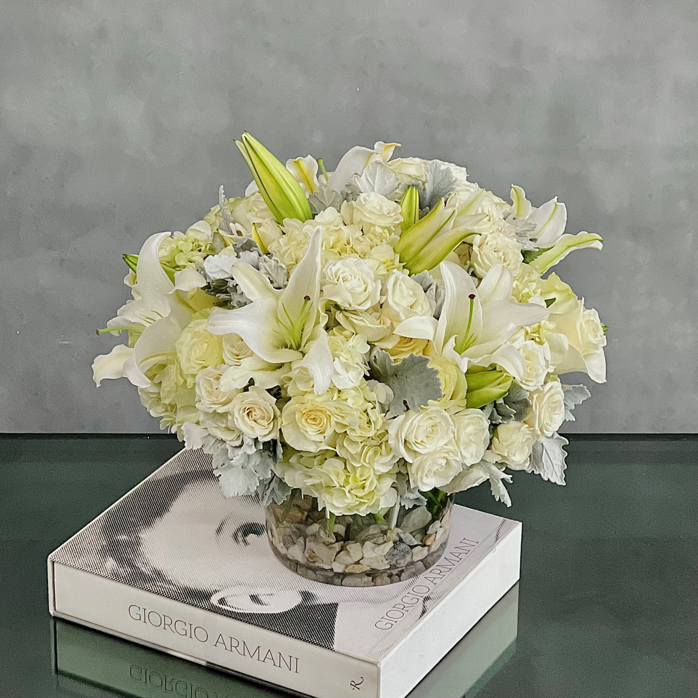 Pearly Whites - Sherman Oaks Florist - This dreamy white floral mix is heavenly. The cylinder glass vase holds an abundant cluster of stunning Roses, Calla Lilies and gorgeous Hydrangeas all in pure white.    Dimensions : 14x14 inches