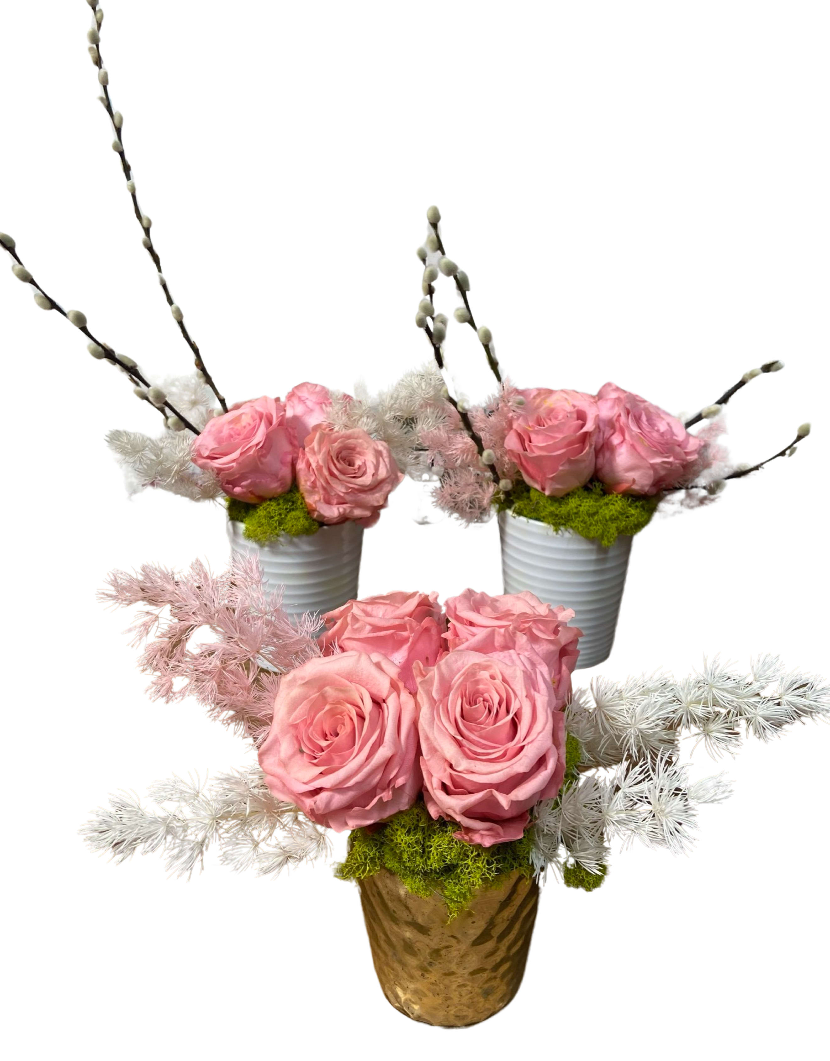 Pink roses arranged in small pots with decorative branches