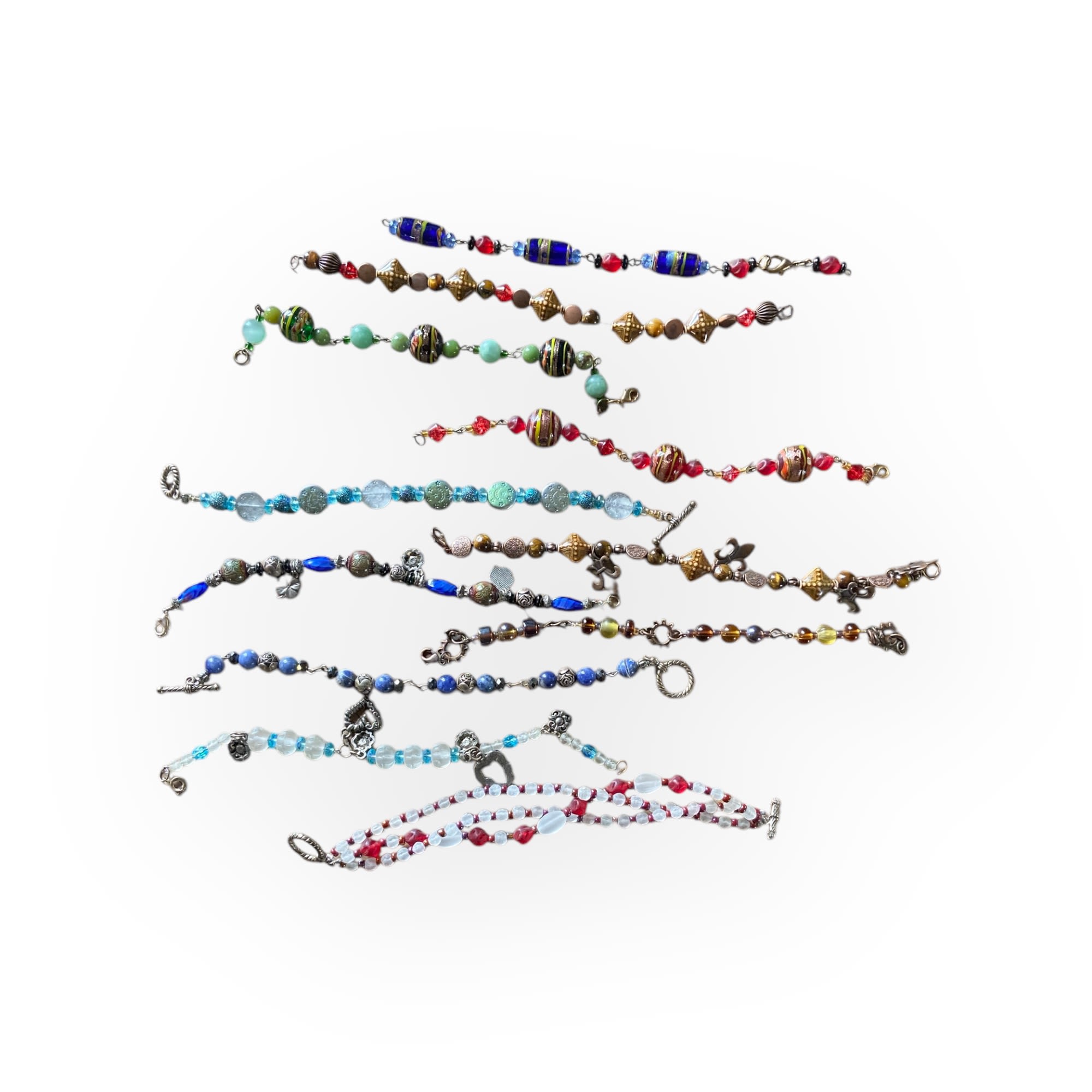 Assorted beaded bracelets laid out on a white background