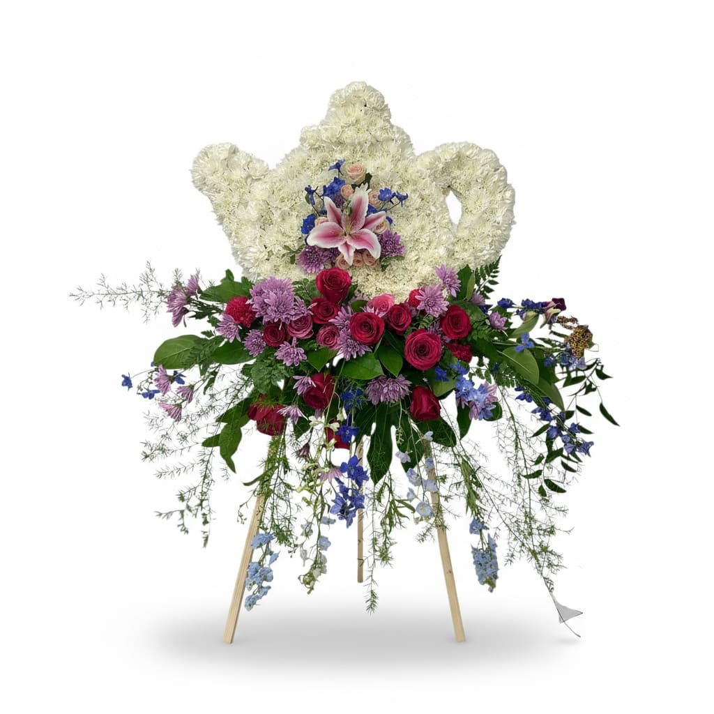 Standing floral spray with white heart-shaped wreath and pink lilies