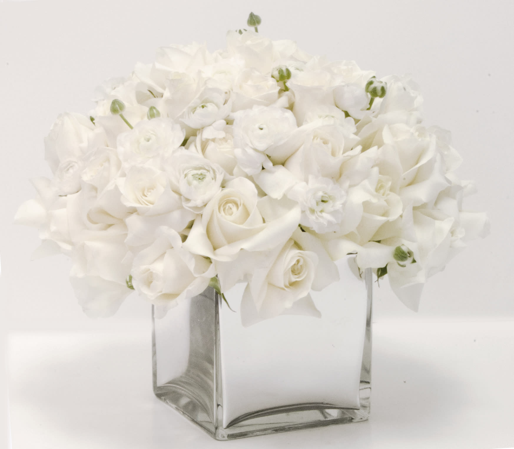 Snowy White Flowers in a Vase - All  White Roses and other seasonal flowers in a vase. NO CARNATIONS, NO DASIES .8"X8" AVAILABLE IN MANY COLORS