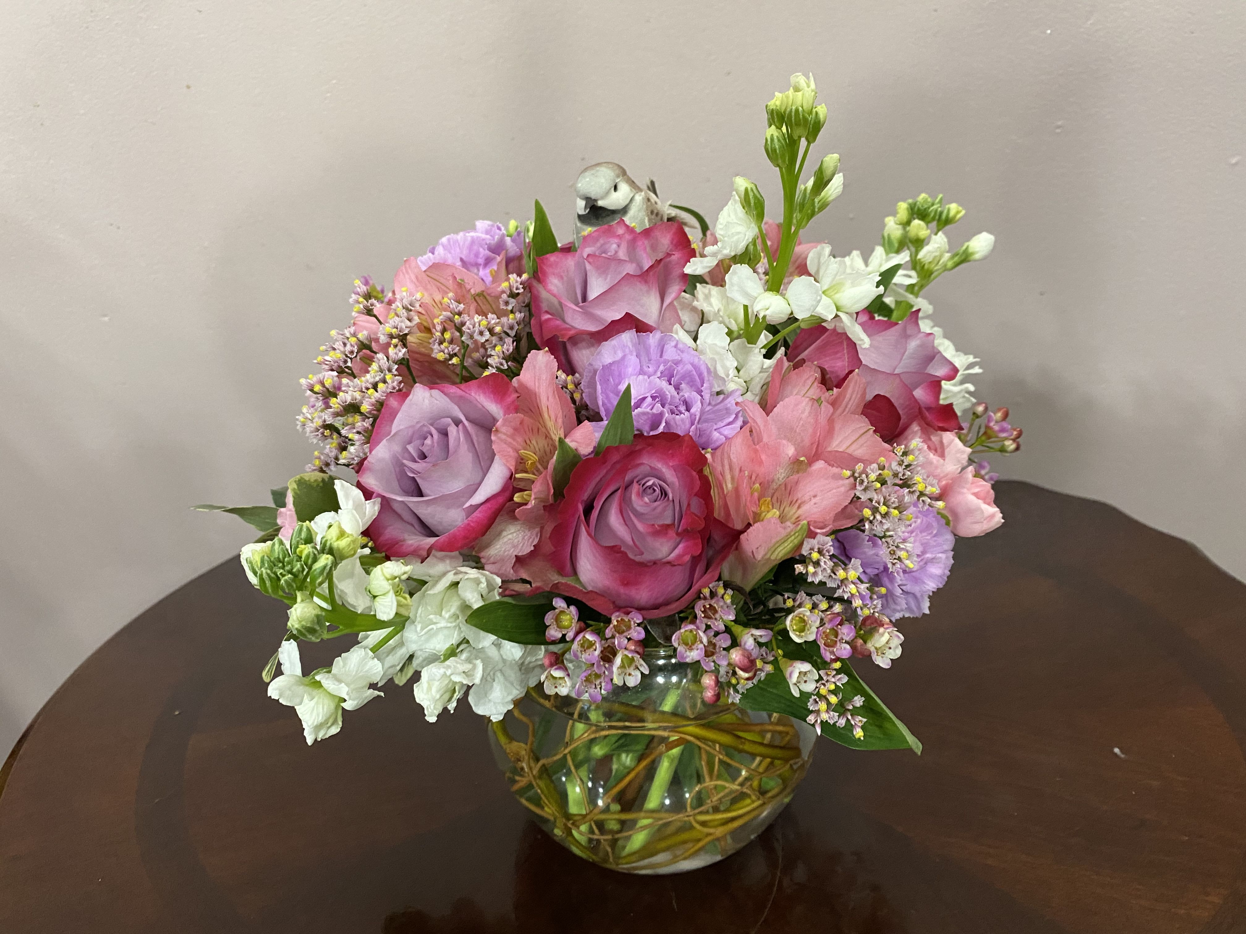 Pink Perfection - This soft display of pink carnations, alstromeria, and purple roses with a touch of white stock is a delicate way to send flowers for an illness, thank you, baby girl congratulations or just because.