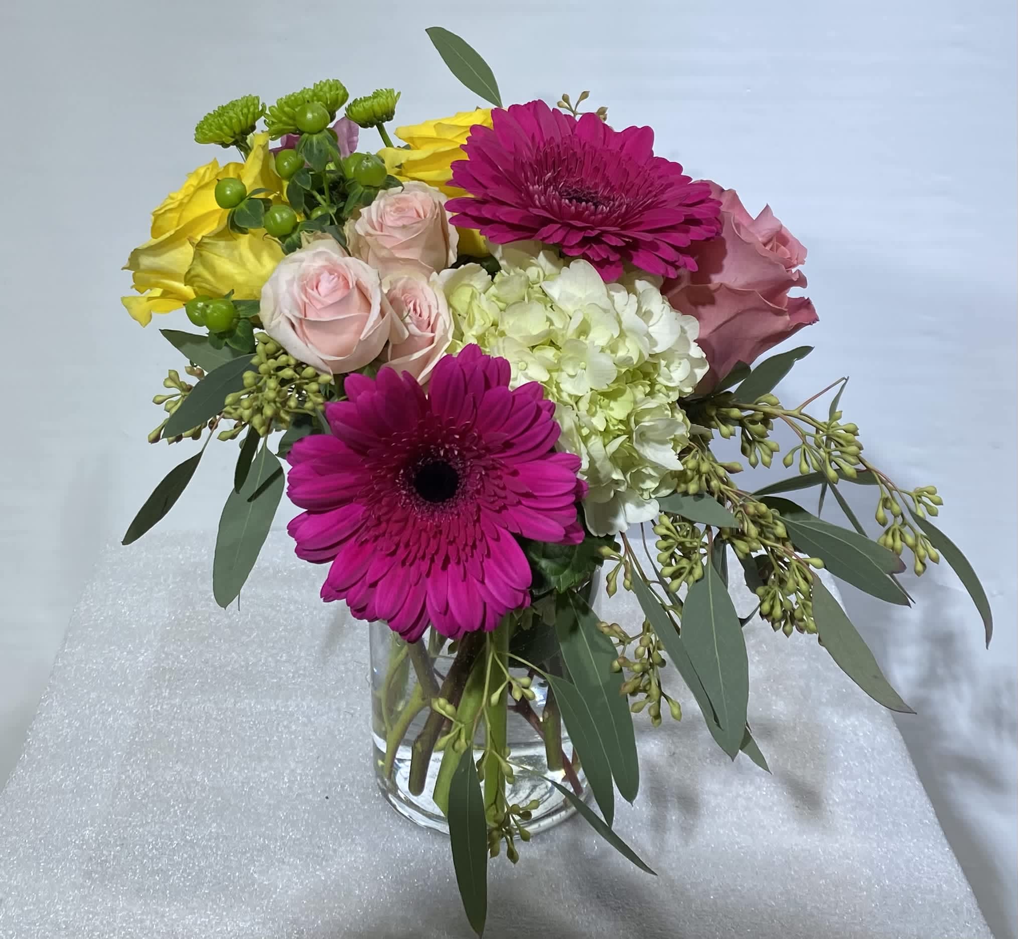 Time To Celebrate by BloomNation™ - No matter what you're celebrating, this is a perfect gift to wish someone praise or honor their new beginnings. This arrangement contains Pink Gerbera Daisies, Roses, and Hydrangea. APPROXIMATE DIMENSIONS: 12"H x 11"D
