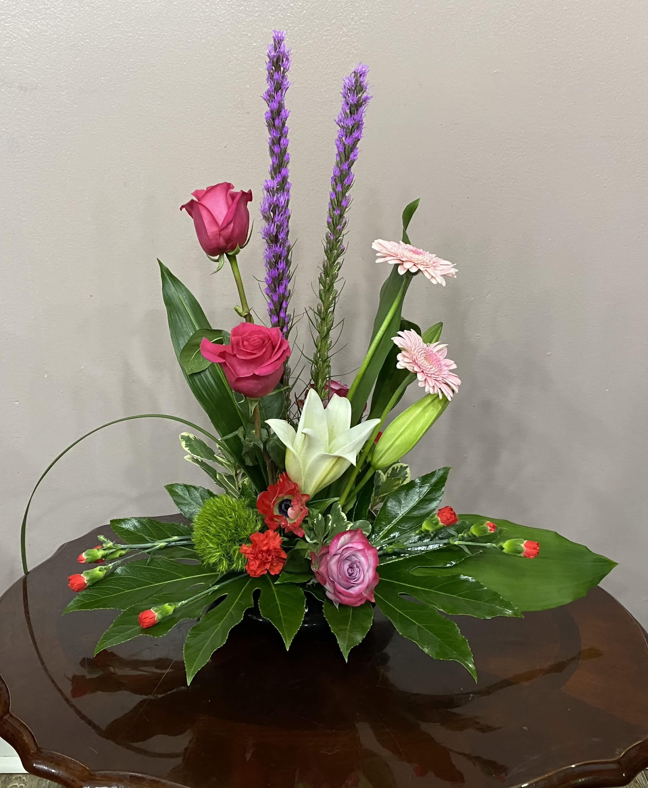 Bon Vivant - A chic display of pink and lavender flowers, elegantly arranged, is a fashionable and feminine gift for a birthday, a pretty arrangement for a buffet table or a wedding shower, or just a lovely present to show someone that you care.