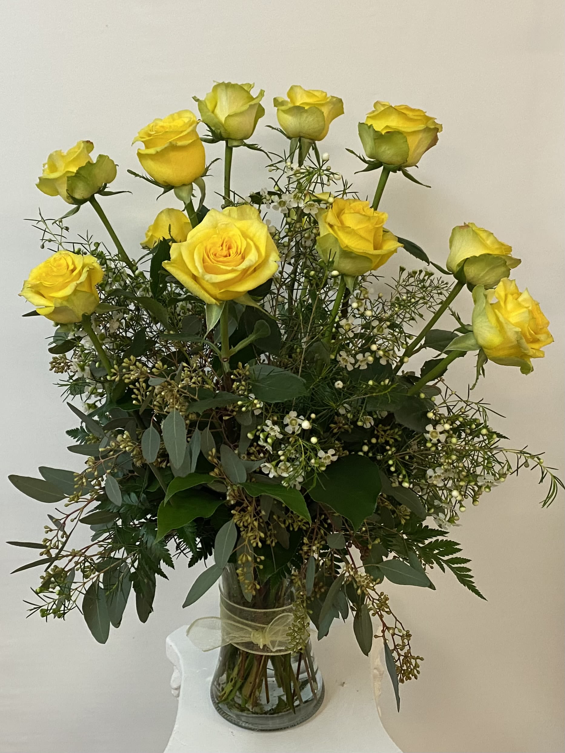 A Dozen Yellow Roses - Yellow roses can have many meanings. A bouquet of a dozen yellow roses may be sent as an expression of Love, gratitude and appreciation. Other times, yellow roses are chosen as an expression of friendship. This pretty bouquet is a thoughtful gift for any occasion.