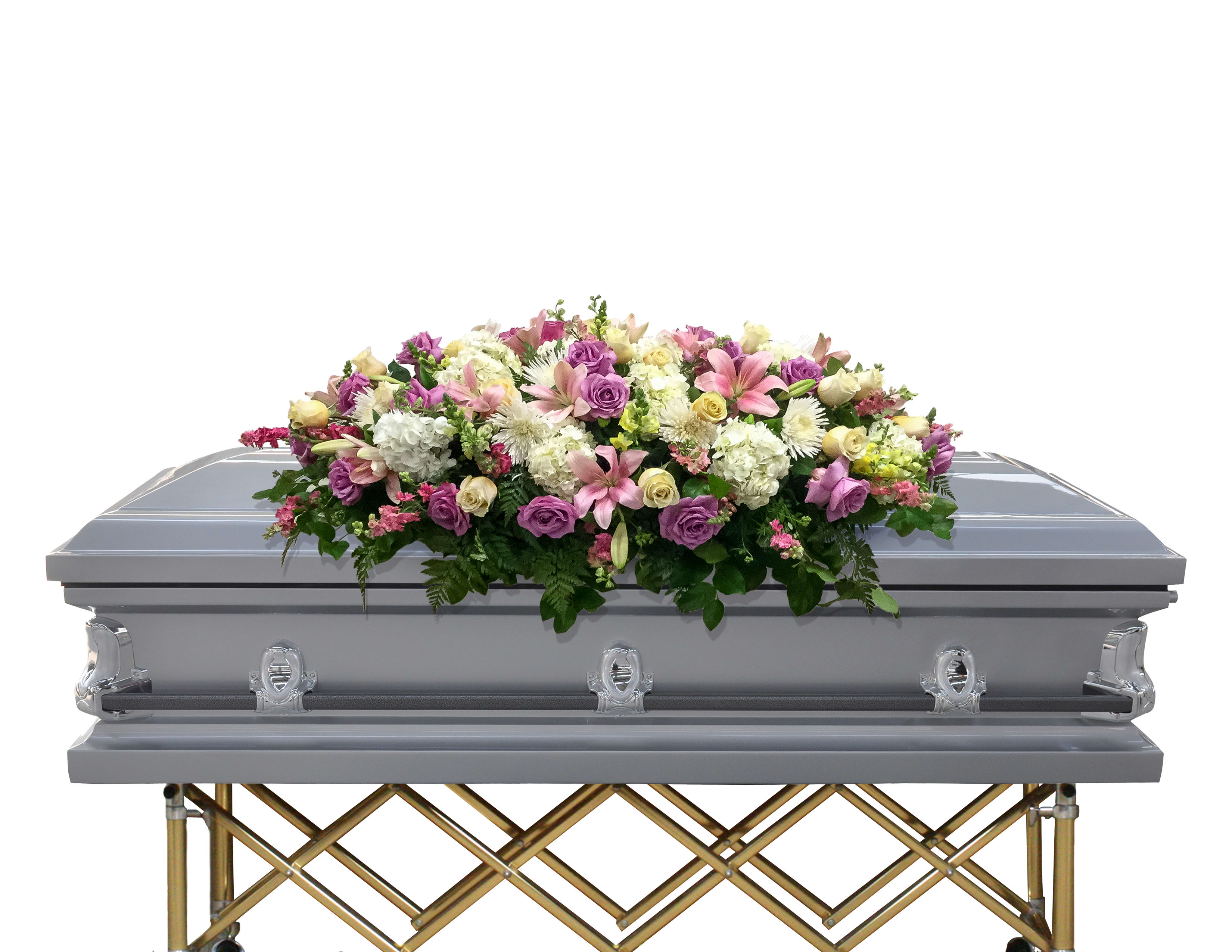 Floral casket spray with pink, purple, and white flowers on a gray casket