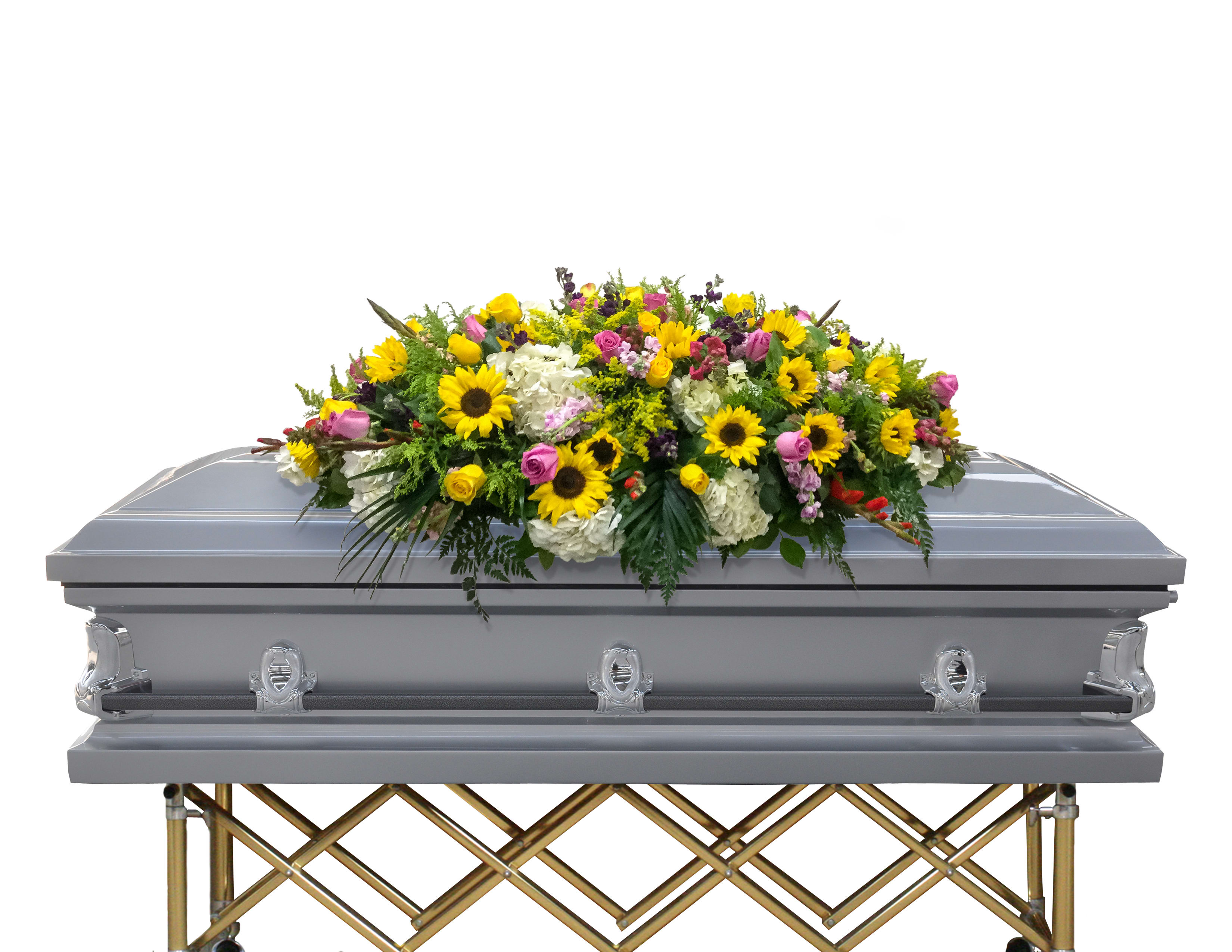 Colorful floral casket spray with sunflowers, roses, and white blooms