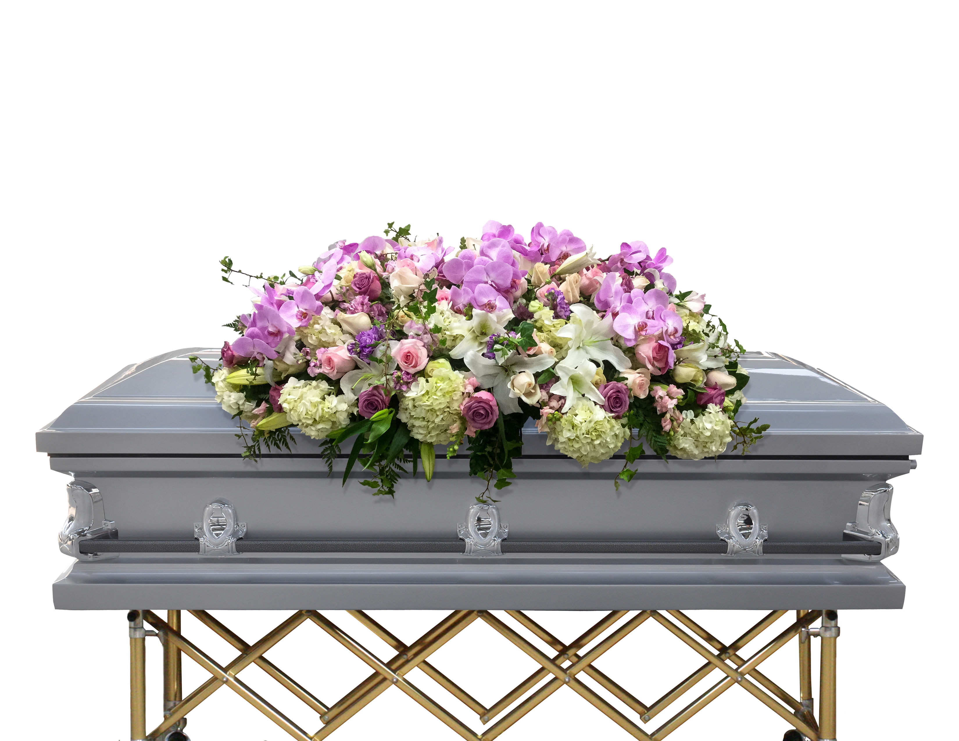 Floral casket spray with pink orchids, lilies, and roses