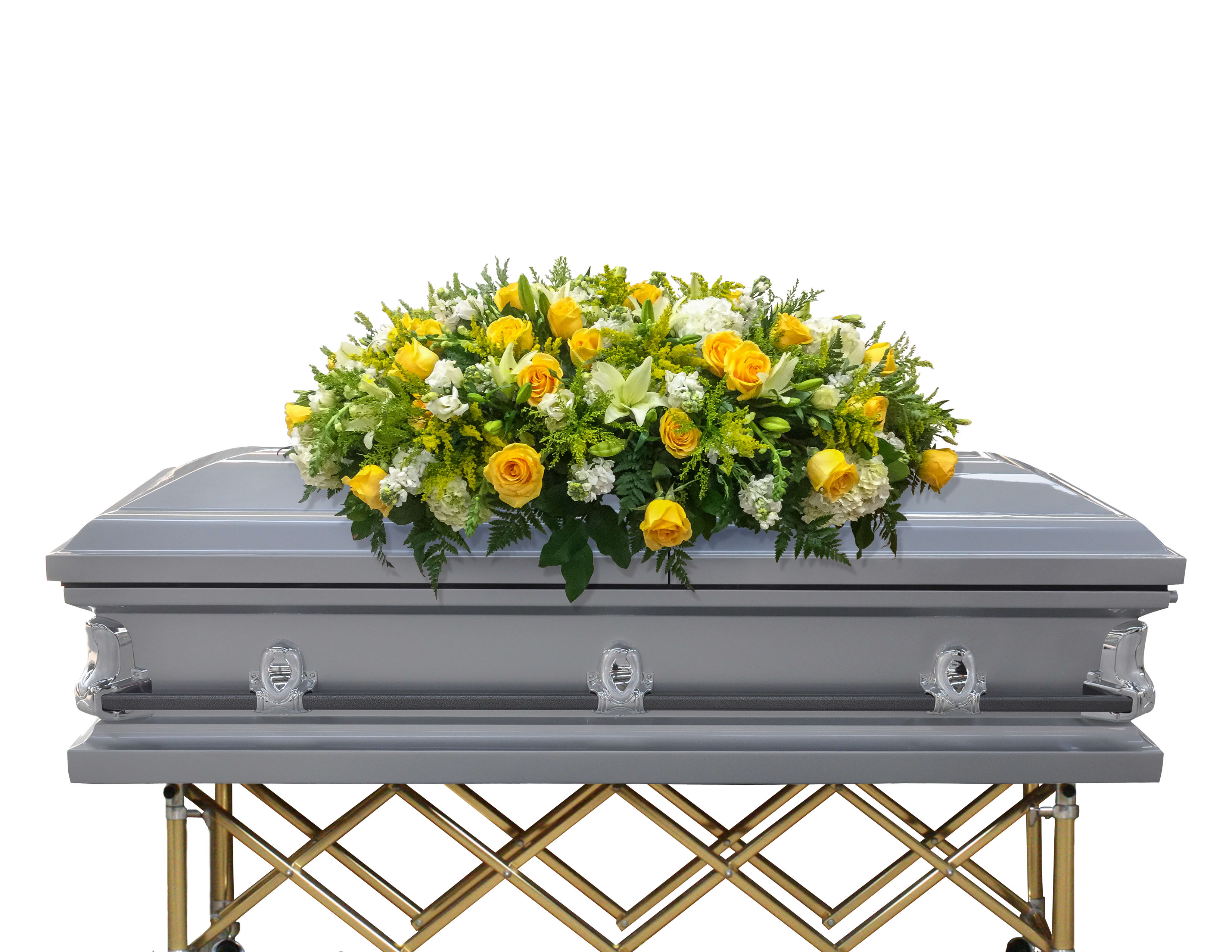 Yellow and white floral casket spray on a gray casket